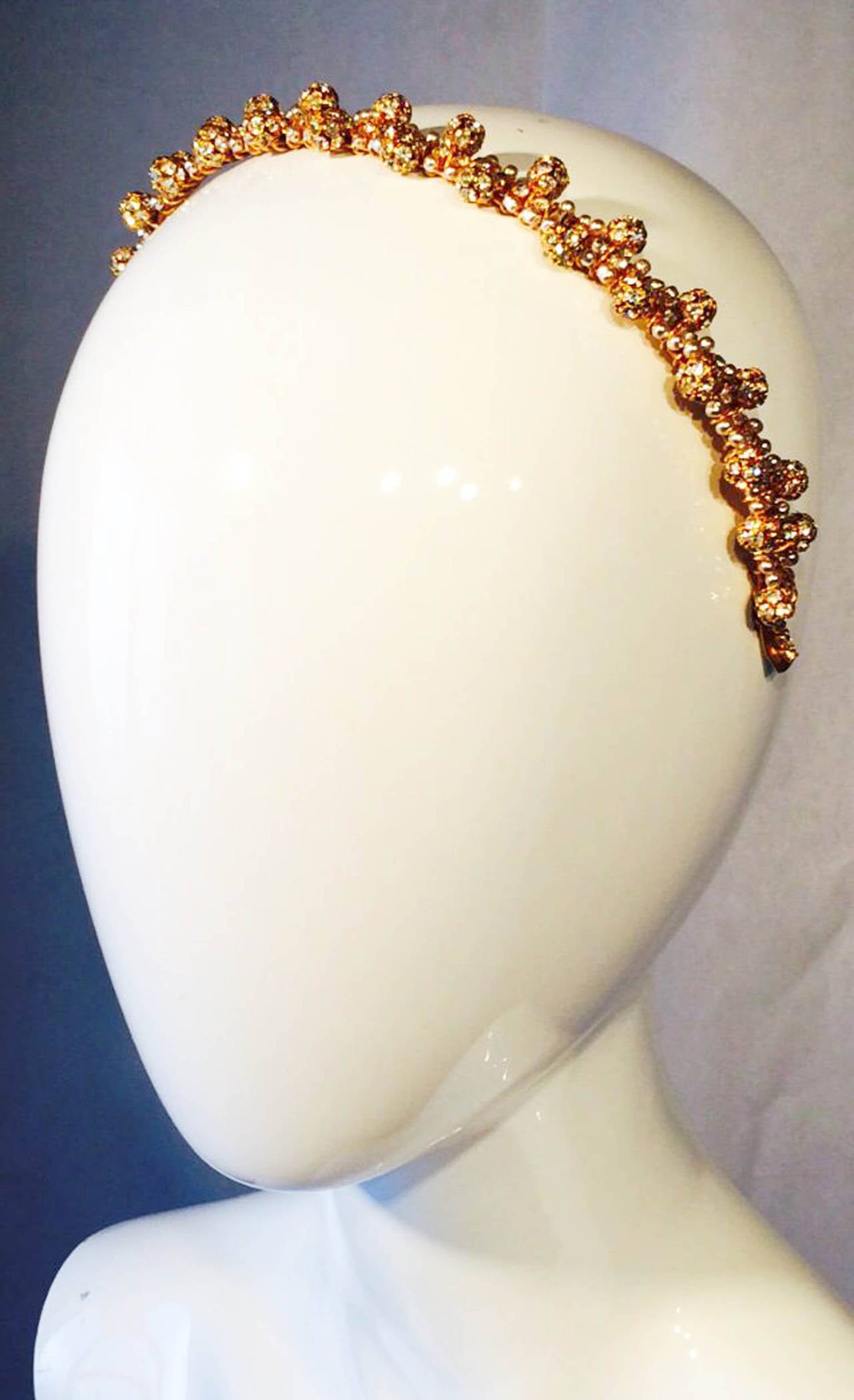 A fine vintage William de Lillo 'jeweled' head band. Signed gilt metal item features hand wired and set crystals and faux pearls. Non-produced one-off sample item from the Wm de Lillo archives. Unworn.