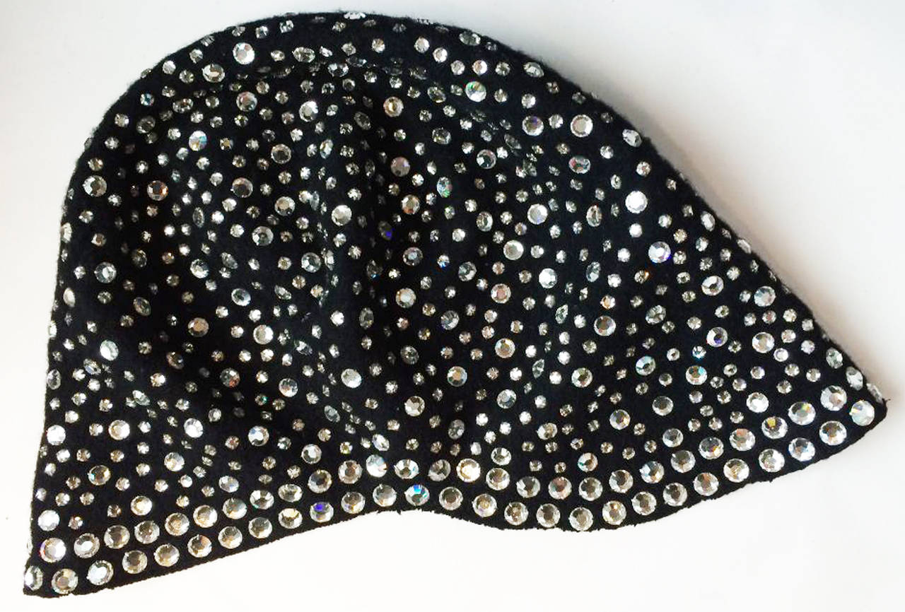 A fine vintage crystal encrusted skull cap previously owned and worn by Dorothy McGuire of the iconic McGuire Sisters. A custom French sculpted jet black wool flannel item covered in prong set Swarovski crystals. Pristine appears unworn.