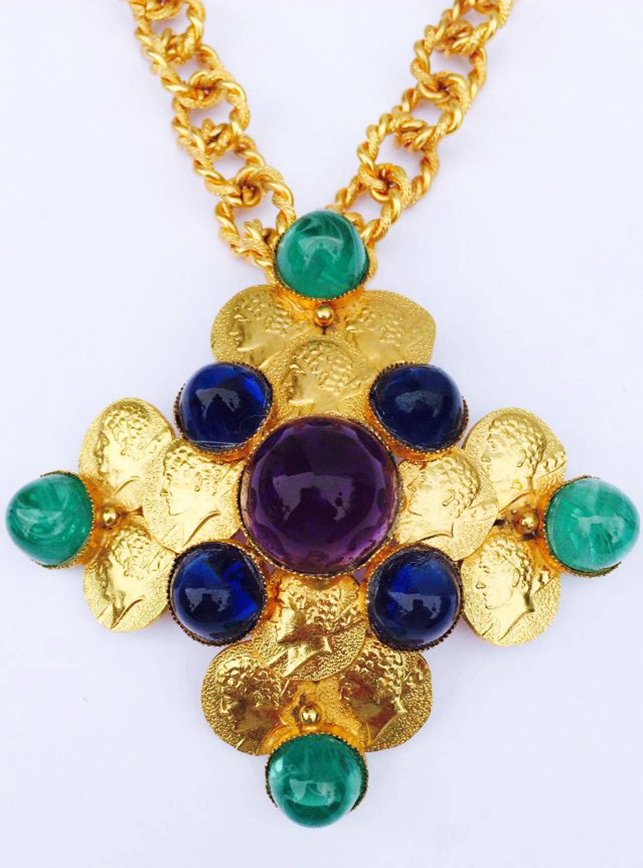 A fine and rare vintage William de Lillo pendant necklace. Signed gilt metal item features a detachable brooch and a 20