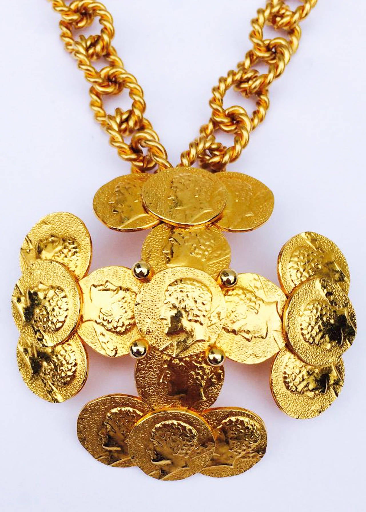 A fine and rare vintage William de Lillo pendant necklace. Signed gilt metal item features a detachable brooch and a 18