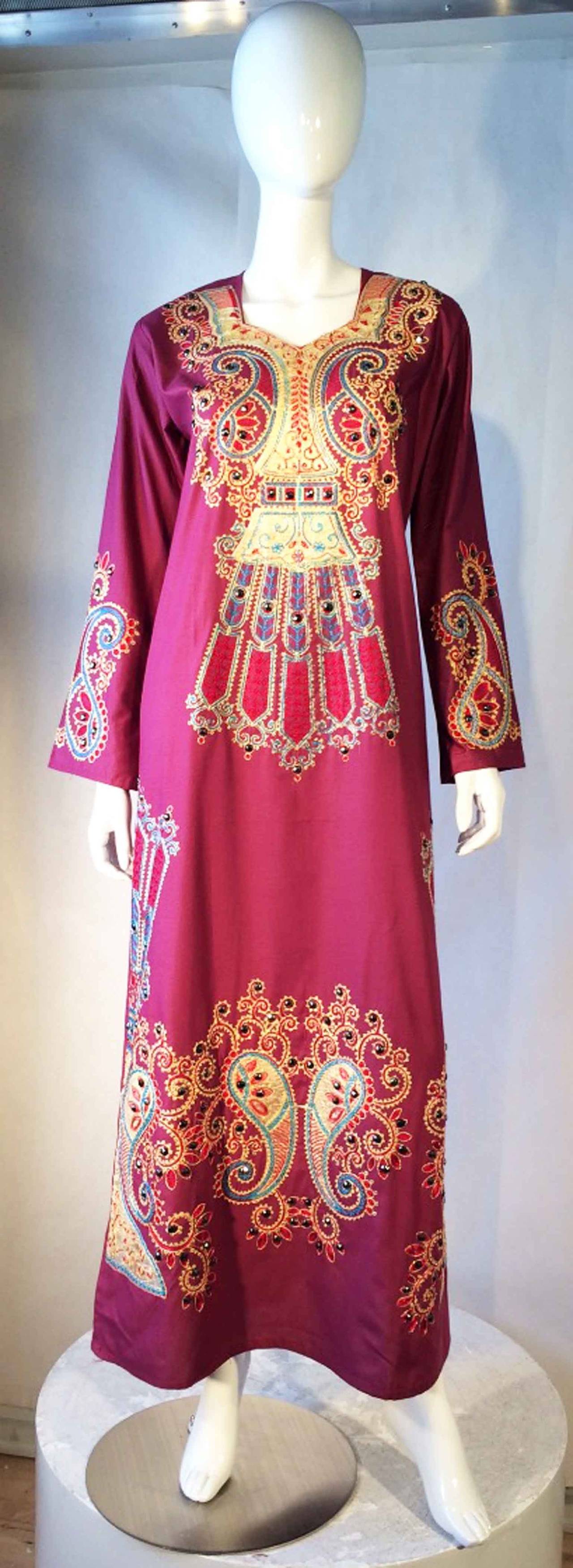 A fine vintage evening caftan. Authentic embroidered and 'jeweled' (front panel) silky fabric item slips over head with no zipper etc. Pristine unworn.