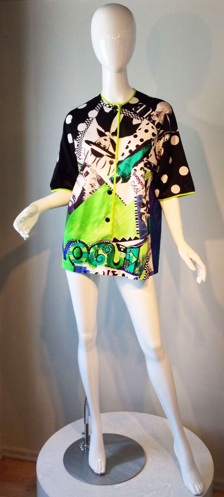 A fine vintage Gianni Versace 'Vogue' print top. Fine silk jersey dynamically printed with a button front. Appears unworn.