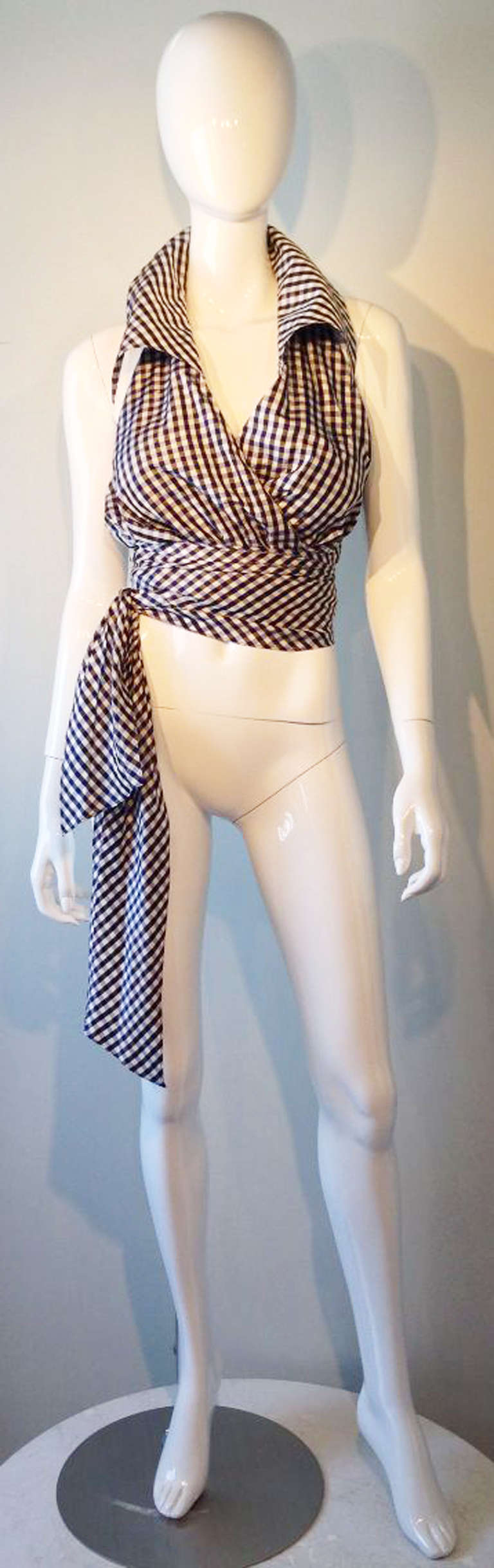 A fine and rare vintage Christian Lacroix evening halter. Silk gingham item wraps front with large pointed spread collar. Attached self tie belt can be tied front or side. Appears unworn.