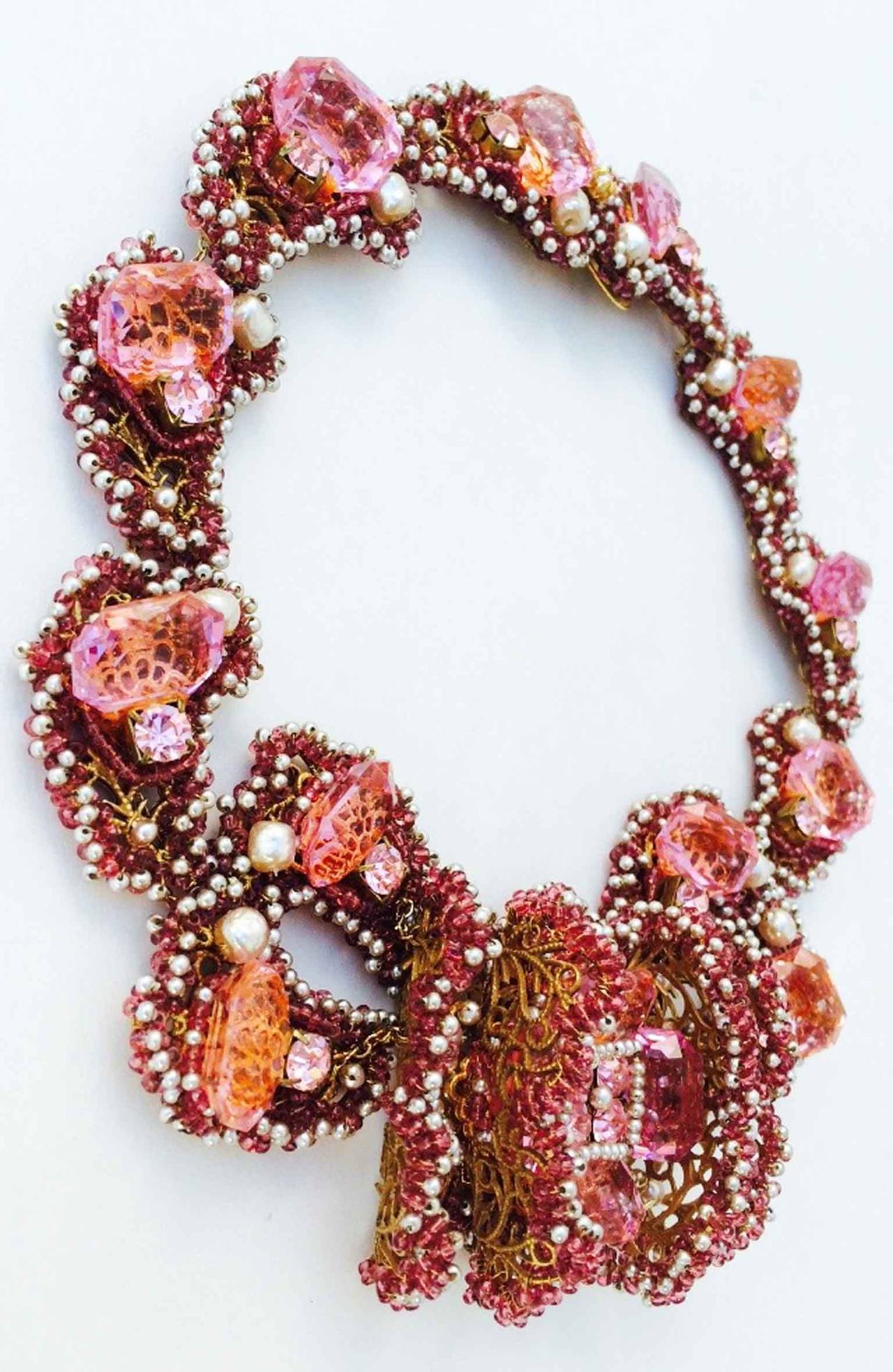 A exquisite vintage William de Lillo couture crystal collar necklace. A special custom one-off commission item for a lady, 1994. Signed gilt metal linked filigree item features emerald cut pink crystal, faux baroque pearls, matching seed beads and