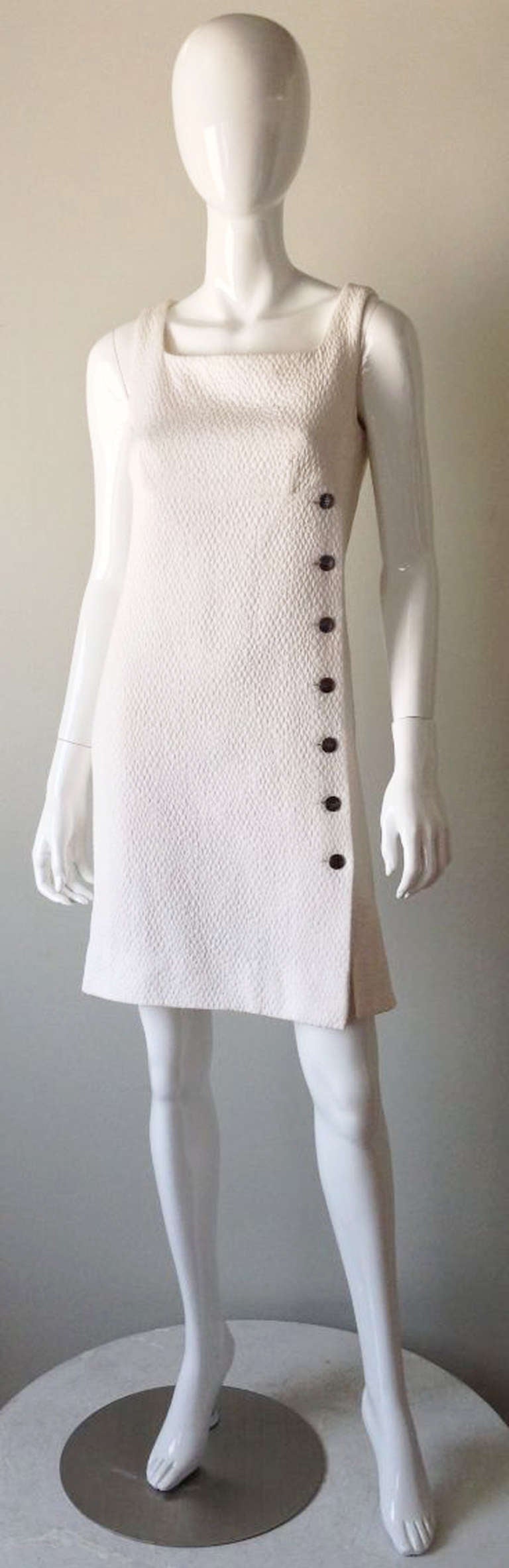 A fine vintage Chanel quilted cotton pique sheath. Fully silk lined white cotton quilted pique fabric item features a false  signature button front and back zipper.