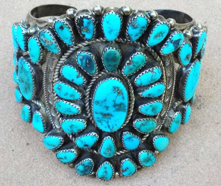 A fine and large vintage Navajo sterling silver and turquoise cuff bracelet. Authentic old pawn item sourced directly from a old Flagstaff AZ. estate. Signed sterling silver item measures 3