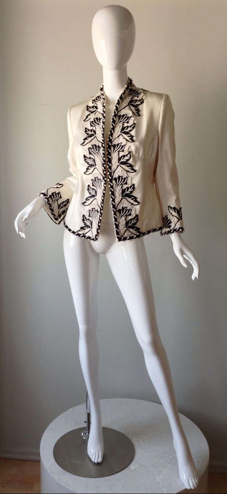 A fine vintage Odicini haute couture embroidered jacket. Exquisite ivory ribbed silk fabric item features elaborate Lesage embroidery front and trim. Item fully silk lined with hidden hook closures. Appears unworn.
