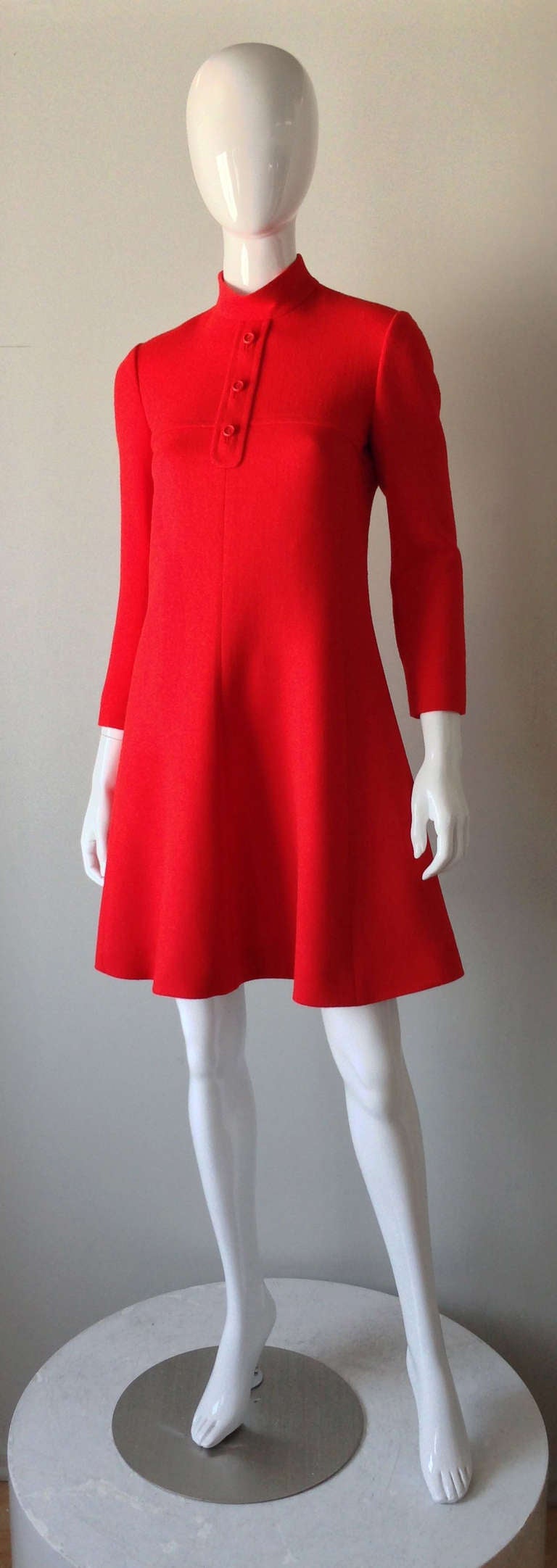 A fine vintage Christian Dior afternoon dress. Bright red wool crepe item features precision seams, faux button front, fully silk lined and zips up back. Rare item for the Japanese market. Pristine appears unworn.