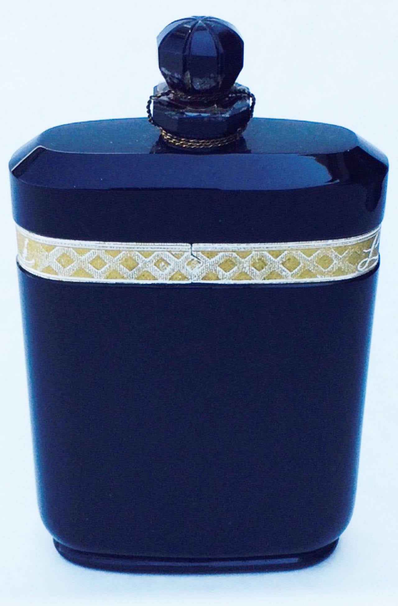 A fine and rare Nuit De Noel by Caron fragrance. Authentic French art deco bottle created by Baccarat, 1922 (hand numbered signature). Original contents and unopened seal intact. A rare survivor appropriate for any collection or archive.