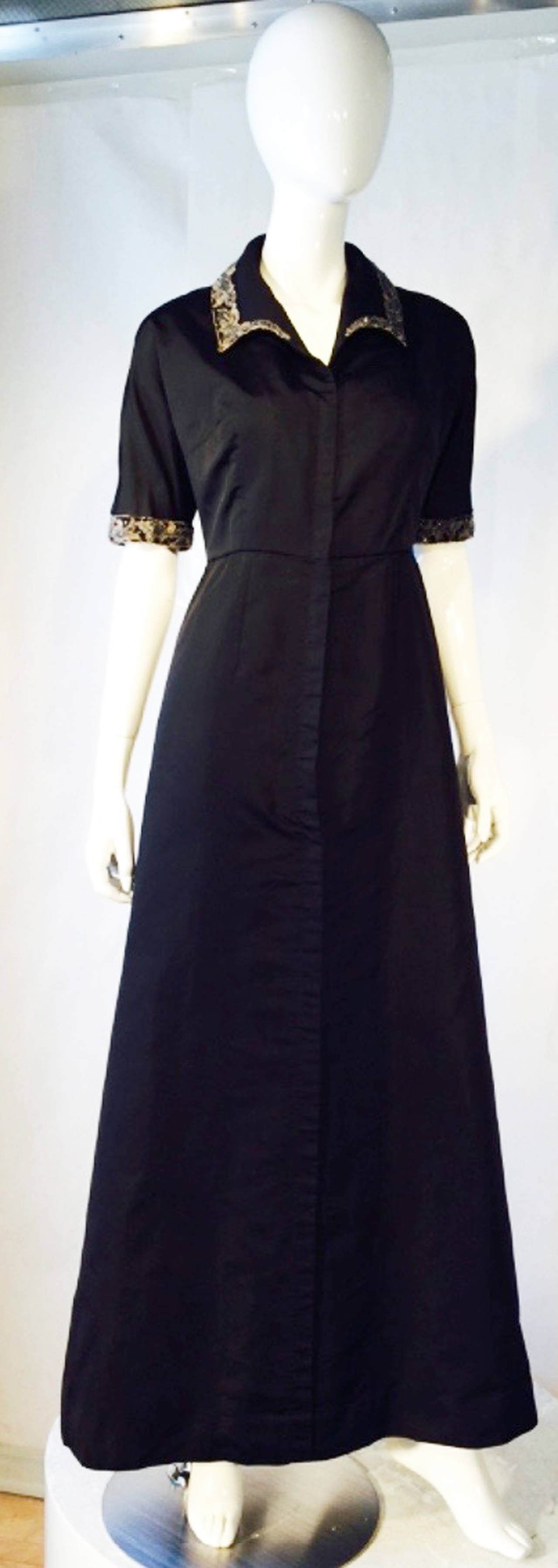 A exquisite and rare Elsa Schiaparelli London haute couture evening gown. A very unusual and elaborately hand constructed item features many of the hallmarks of Elsa Schiaparelli regarding fabric, construction and the use of the metal Liberty zipper