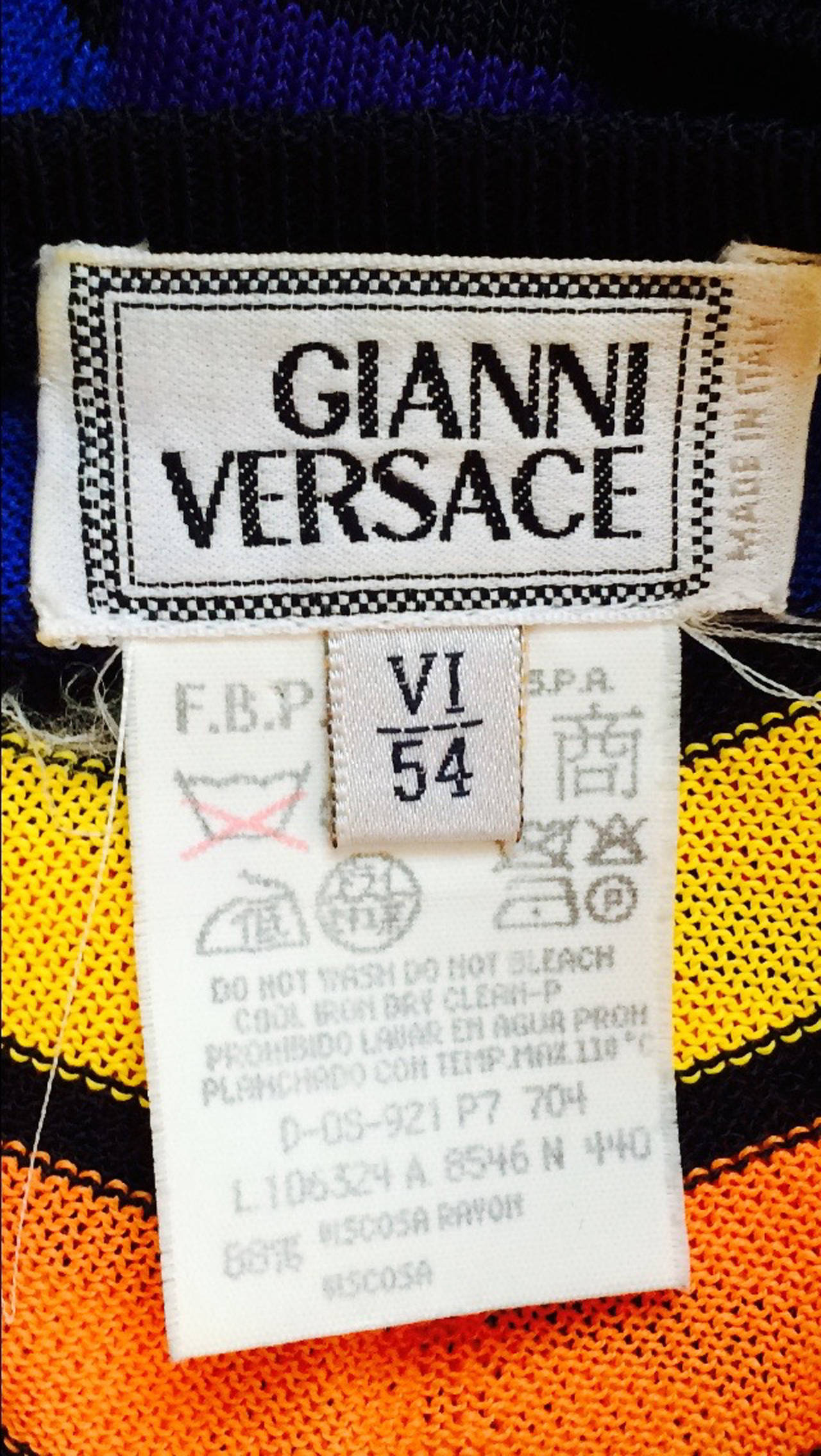 A fine gentleman's Gianni Versace knit tee shirt top. Authentic silky zig-zag knit fabric item pulls over head with no closures. Pristine appears unworn.