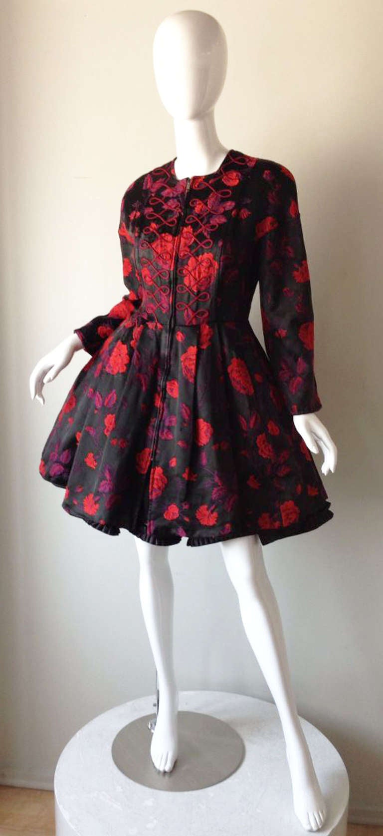 A fine and rare vintage Christian Lacroix pouf cocktail dress. Heavy silk floral brocade fabric item features a nipped waist, 
