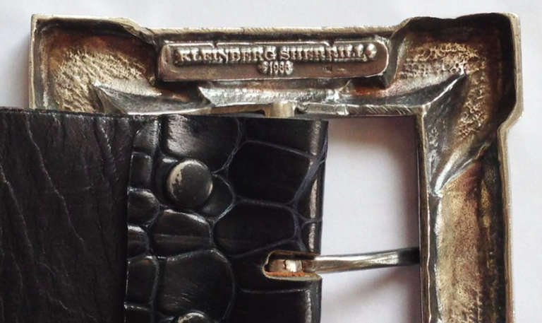 A fine and rare vintage Kleinberg Sherrill alligator cinch belt with large sterling silver buckle. Signed and dated buckle attached to a signed black alligator belt measuring 2