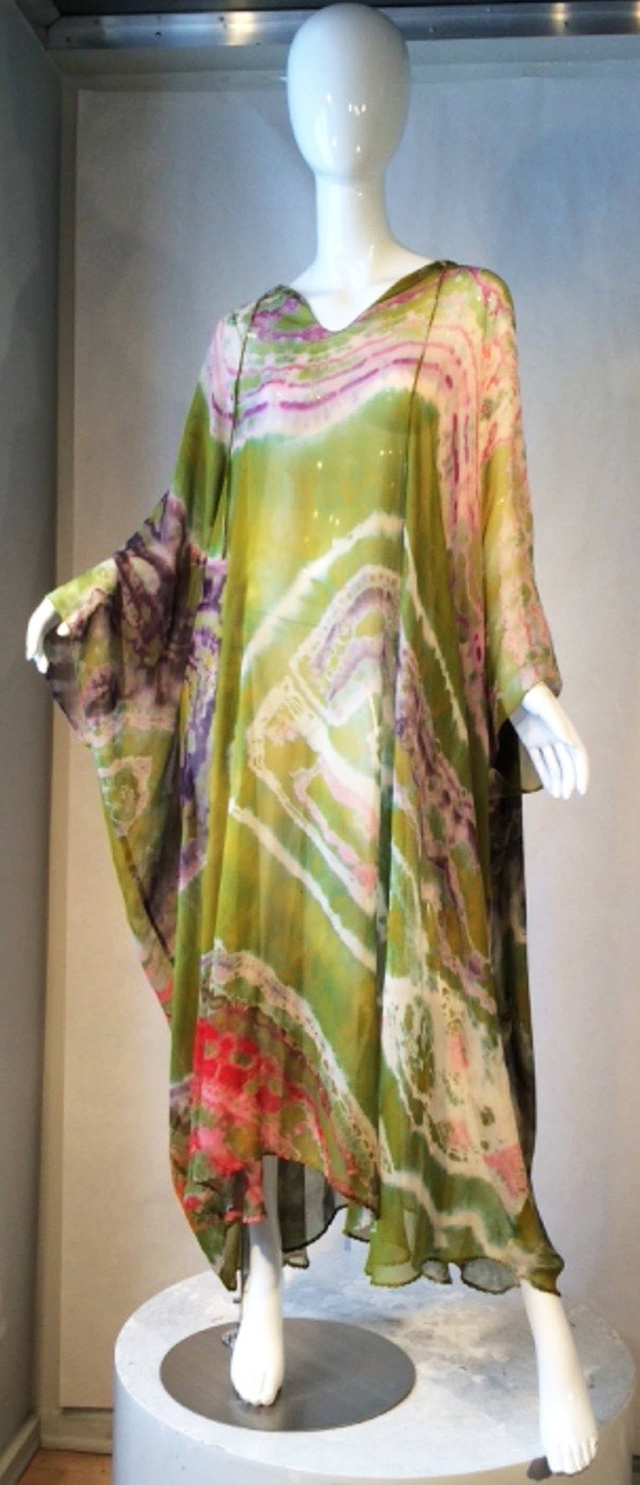 A fine and rare vintage Halston tie-dyed caftan. Hand dyed silk chiffon item features neck ties and hand rolled edges and hemline. Unlabeled. Excellent.