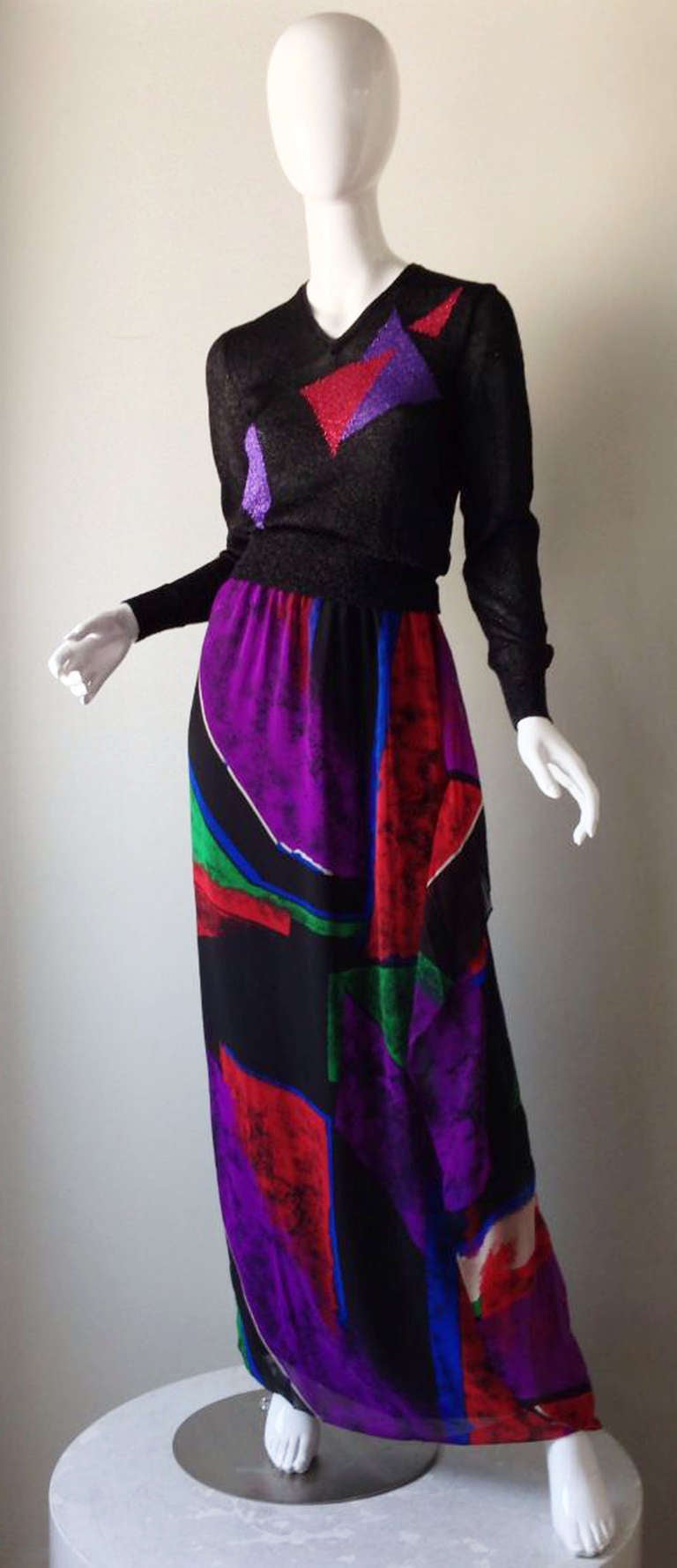 A fine vintage Hanae Mori 2pc. cocktail gown. Unworn item with original hang tag intact. Sparkly Lurex knit top with matching silk print floor length skirt. Faux wrap skirt fully lined and zips up side. Pristine, unworn.