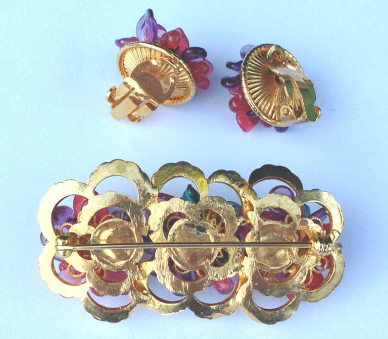 A fine and rare vintage Louis Rousselet brooch and matching ear clips. Gilt metal items feature signature Rousselet glass 