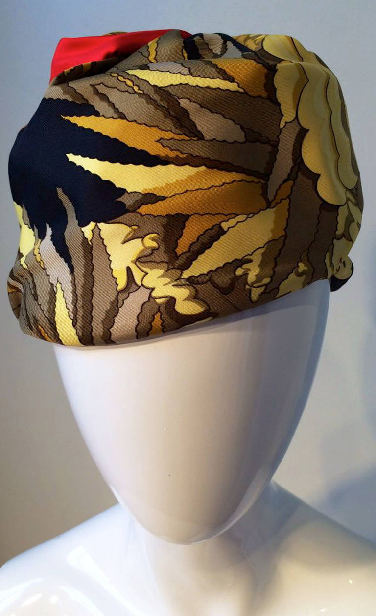 A fine vintage Hermes turban. Vibrant and crisp silk twill print item appears unworn with original box intact.