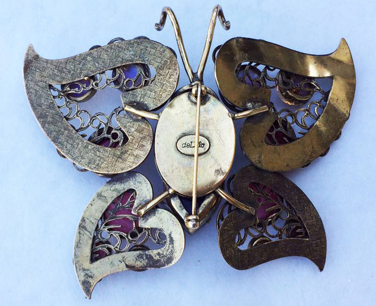 A fine and rare vintage William de Lillo butterfly brooch. Large prototype item from the Wm de Lillo archives. Signed gilt metal item features art glass 