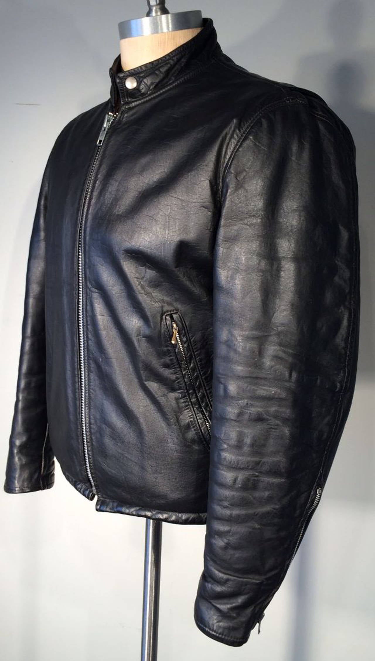 A fine gents vintage black leather cafe racer/motorcycle jacket. Top grade black leather item fully lined with zipper and snap tab collar closures. Excellent.