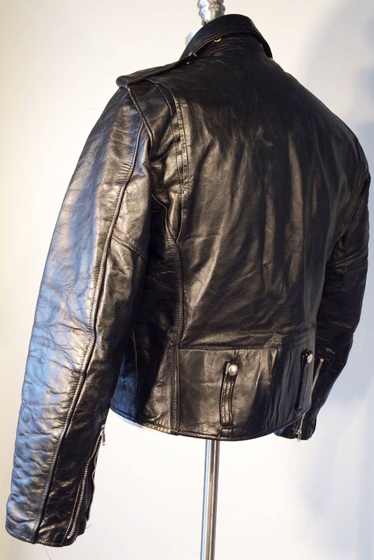 A fine vintage AMF/Harley-Davidson black leather motorcycle jacket. Top grade black leather item fully quilt lined with metal zipper and snap closures. A honest jacket in excellent condition.