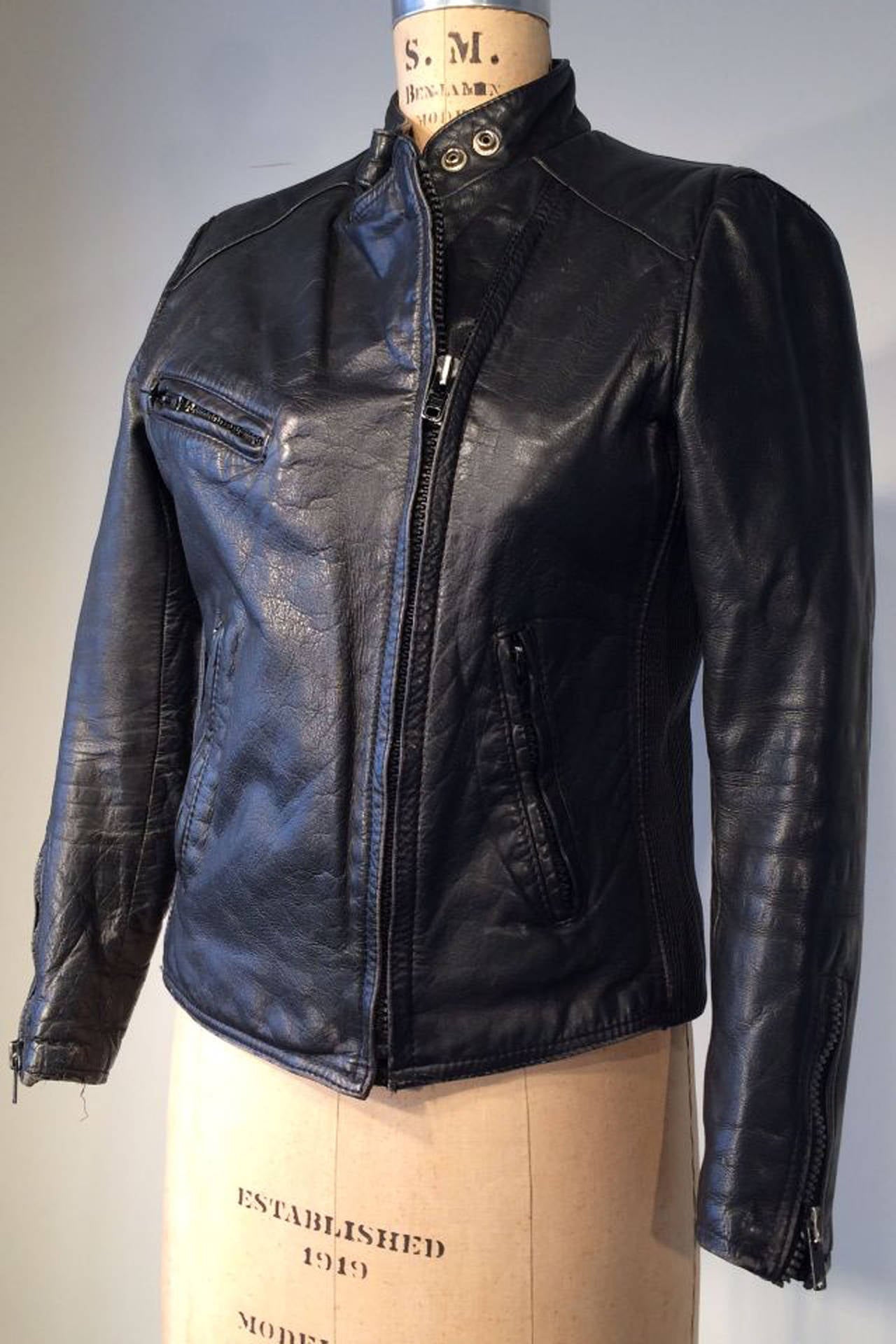 A fine vintage Hein Gericke for AMF/Harley-Davidson black leather cafe racer/motorcycle jacket. Top grade black leather item fully lined with zipper and snap closures. Honest item in excellent condition.