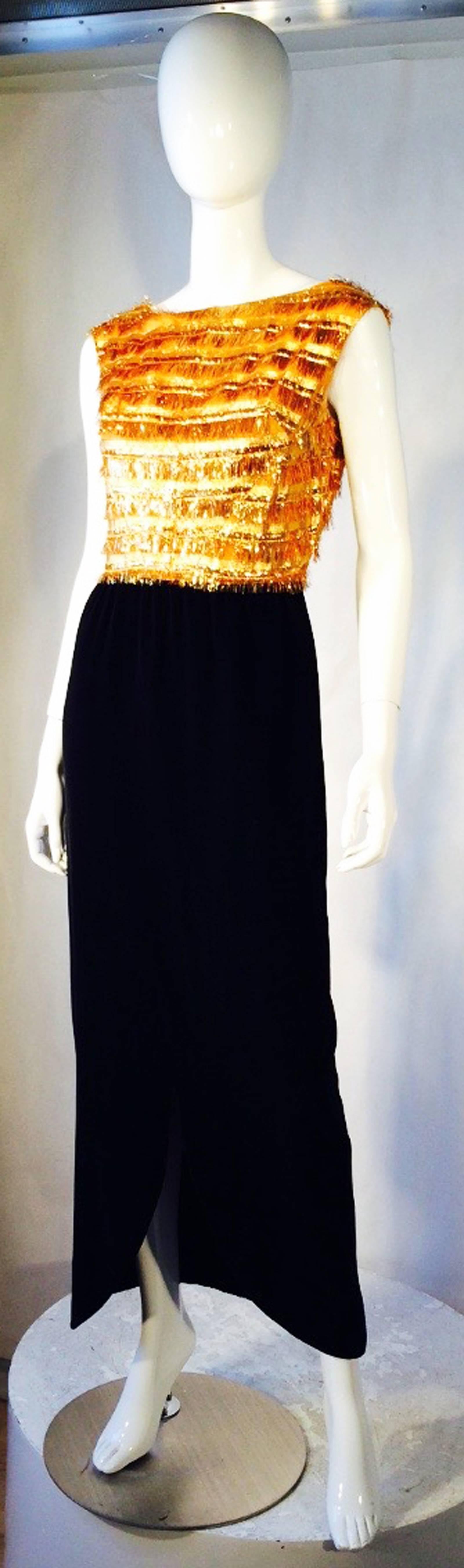 A fine and rare vintage Nina Ricci haute couture evening gown. Authentic metallic gold Lurex 