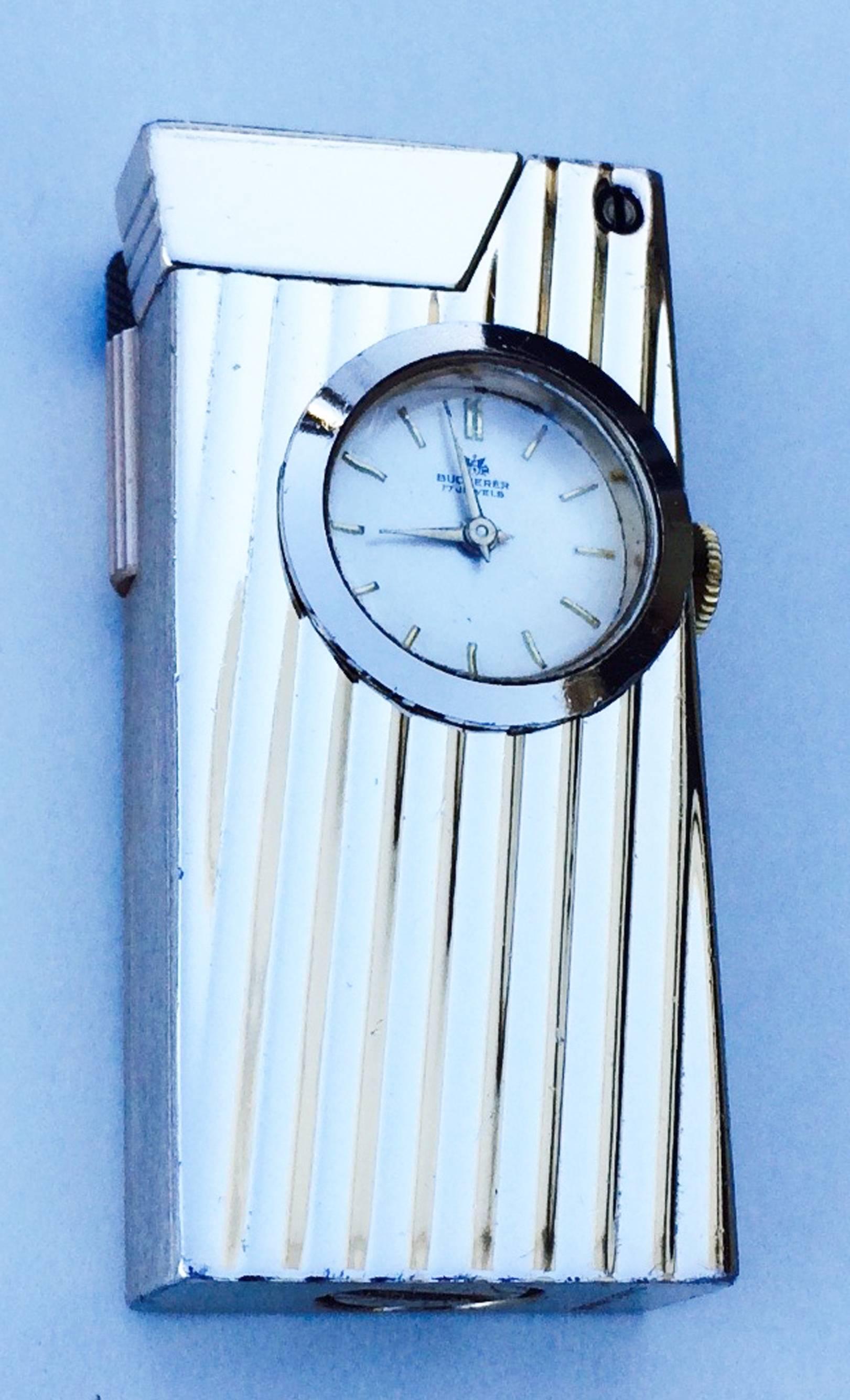 A fine vintage Bucherer lighter watch. Authentic signed gilt item features a Swiss mechanical 17 jewel timepiece and signature box. Both lighter and watch working properly. Excellent.