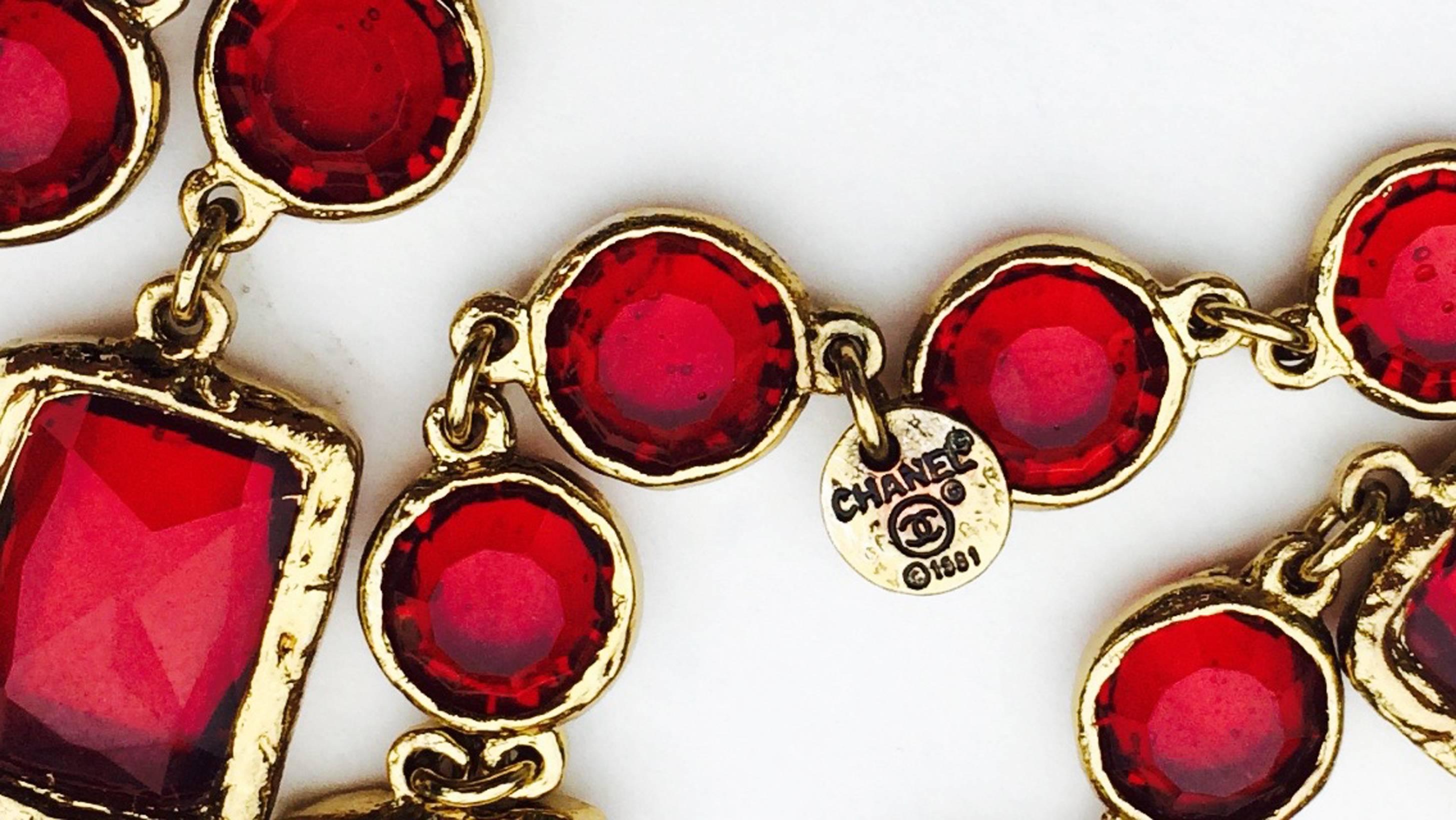 A fine vintage Chanel red crystal sautoir necklace. Authentic signed gilt metal link item features both 