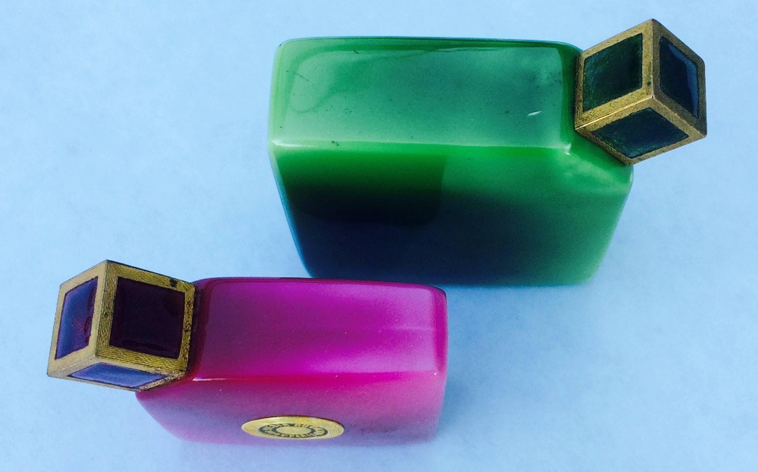 A fine and exquisite pair Baccarat scent bottles for Ybry. Authentic patte de verre glass bottles and matching gilt metal caps. Rare items circa 1926. Green bottle measures 2.5