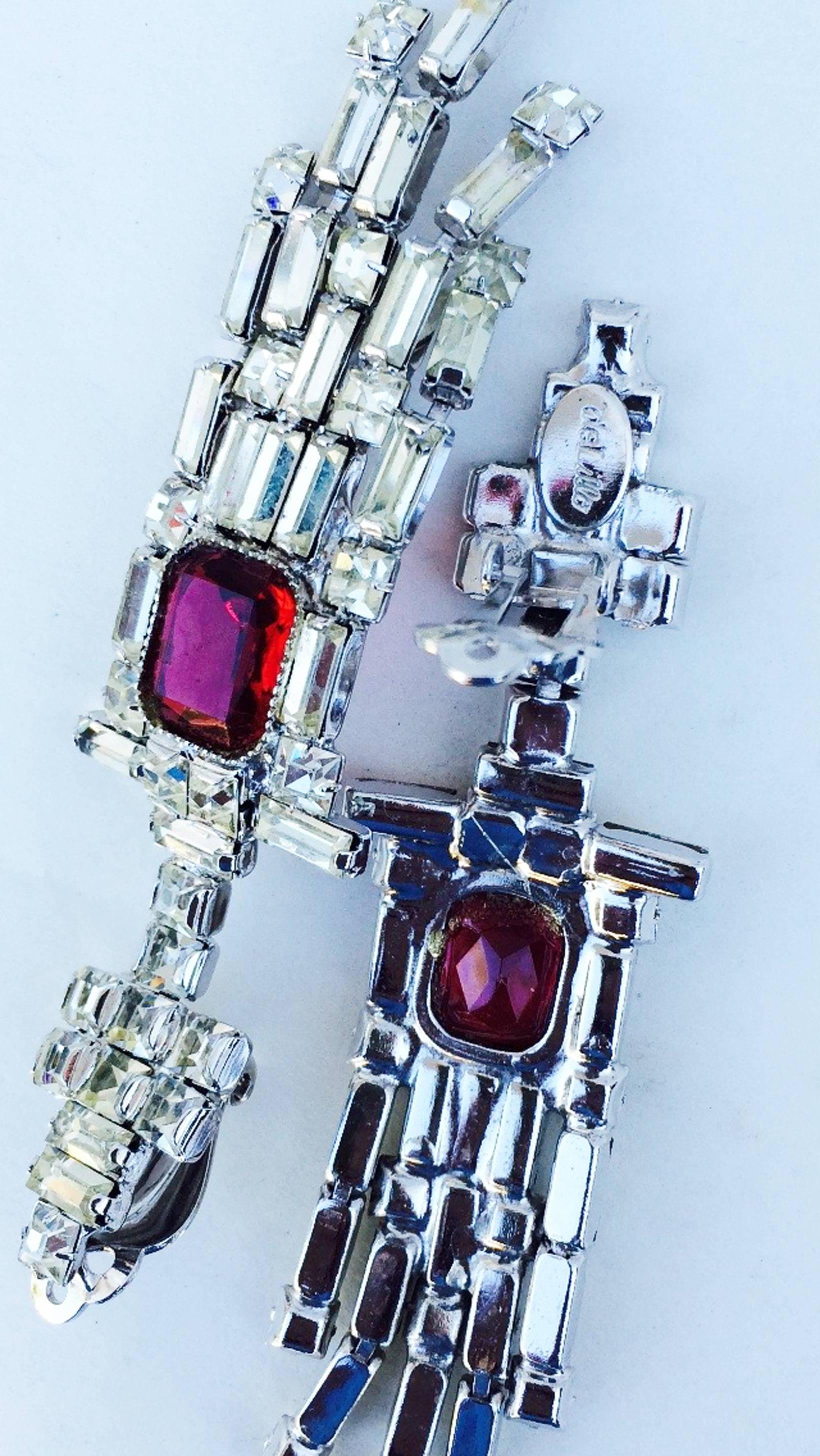 A exquisite vintage pair Wm. de Lillo faux jewels ear drops. Signed Rhodium plated metal items feature faux square cut 