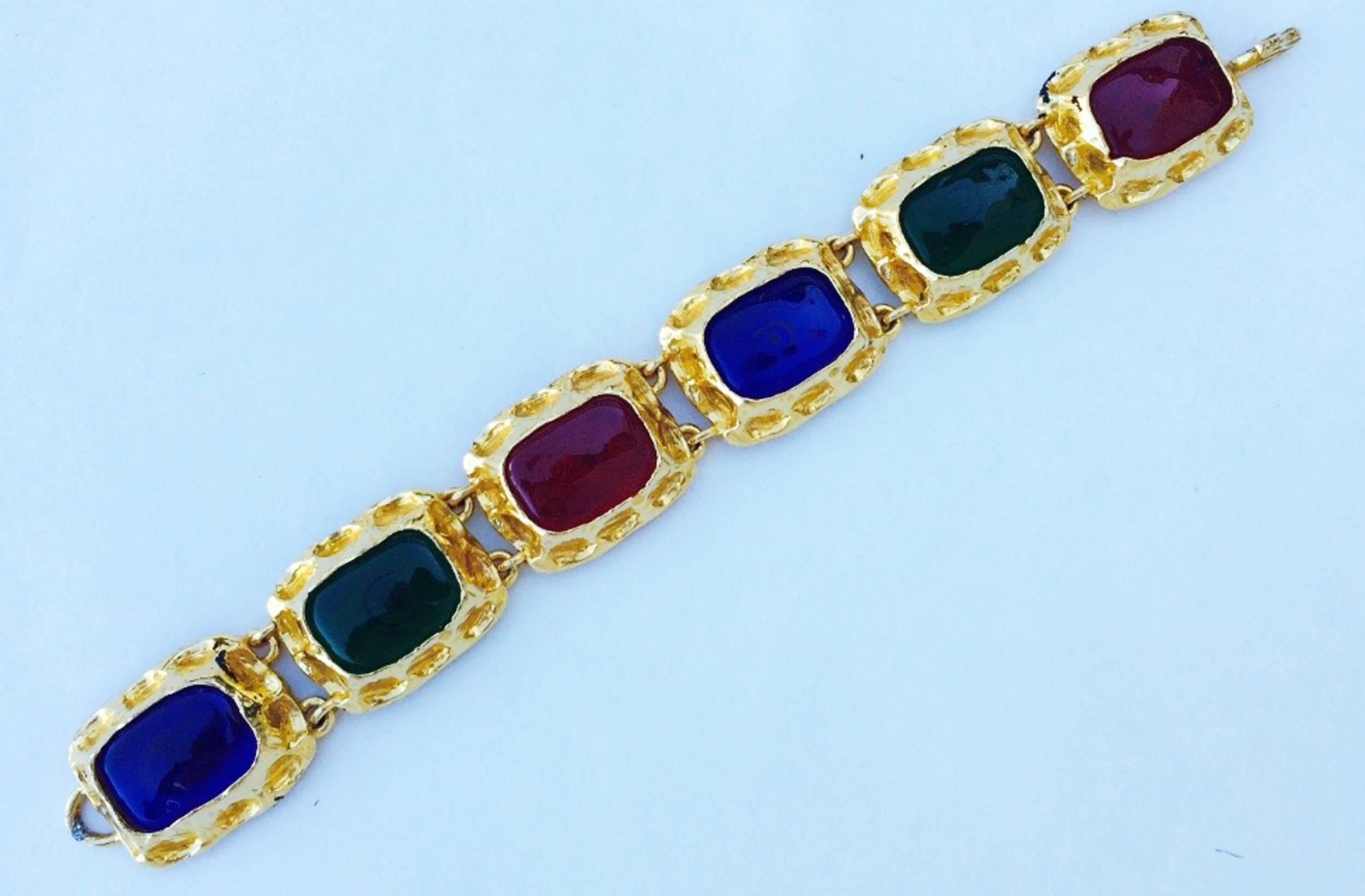 A fine and rare vintage Chanel link bracelet. Signed gilt metal link item features alternating blue, red, green Maison Gripoix poured glass 