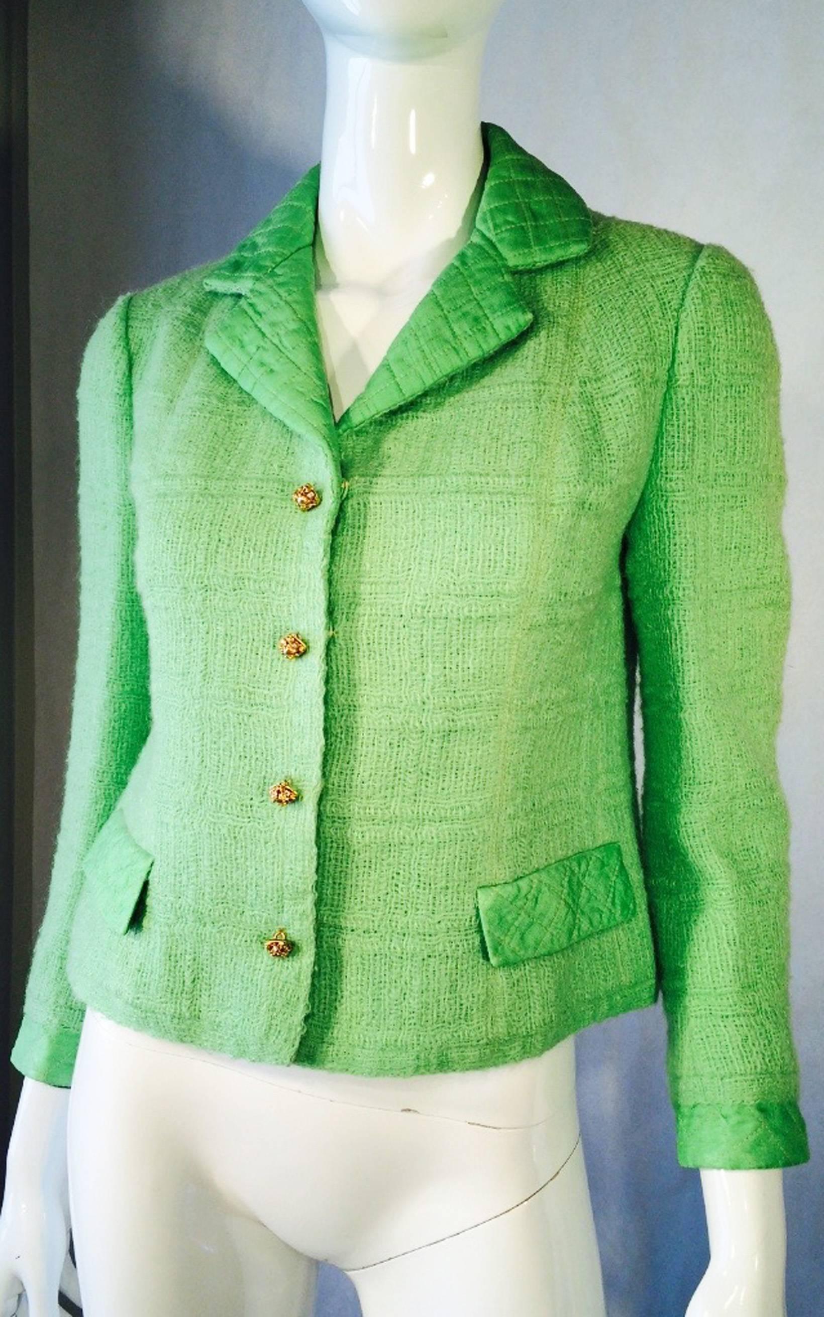 A fine and rare vintage Capucine jacket. Vivid pistachio green wool item trimmed with matching color quilted silk collar, cuffs and pocket flaps. Item features hidden snap closures and exquisite gilt filigree buttons with crystals and faux baroque