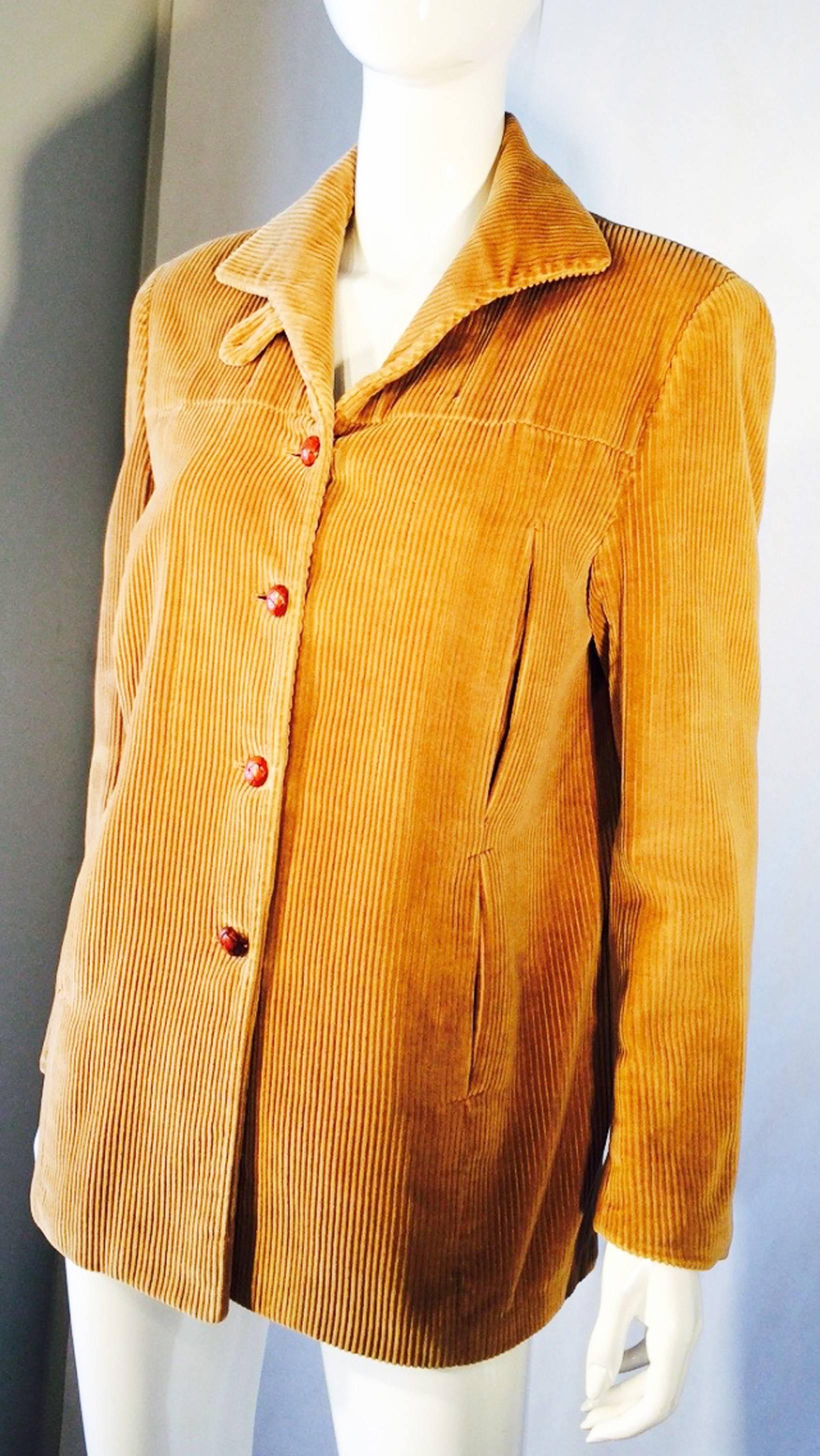 A fine and rare vintage Edith Head corduroy jacket. Authentic item inspired by the Edith Head costume designs from the Hollywood film, The Buccaneer (1958). Golden cotton corduroy fabric item features leather knot button closures and fully lined.