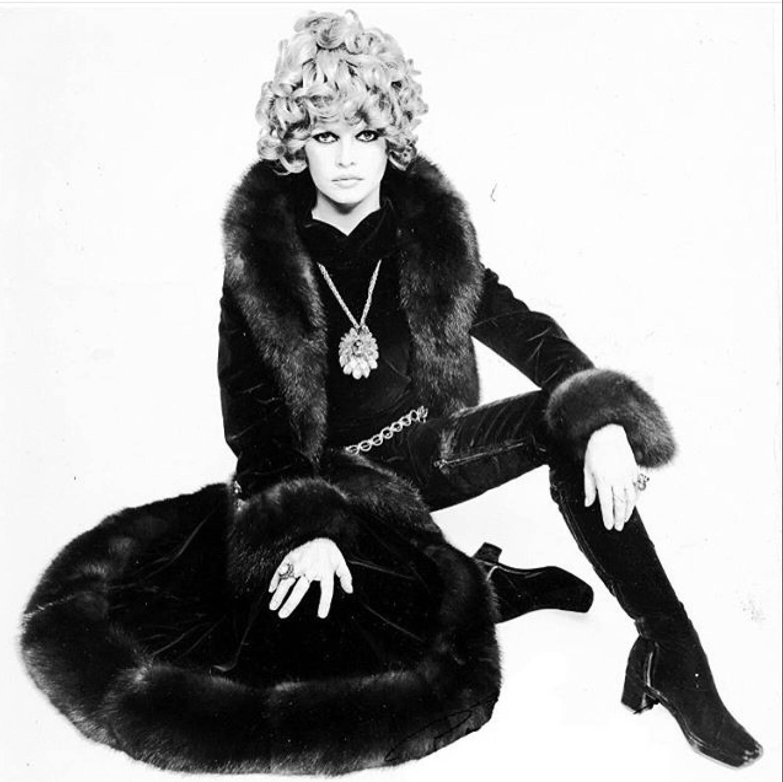 A fine and rare vintage Christian Dior haute couture fur coat. Hand described and numbered item ordered from photo of Brigitte Bardot wearing same style, ca.1970. Authentic supple sheared beaver coat trimmed in luscious fox fur. Item features a