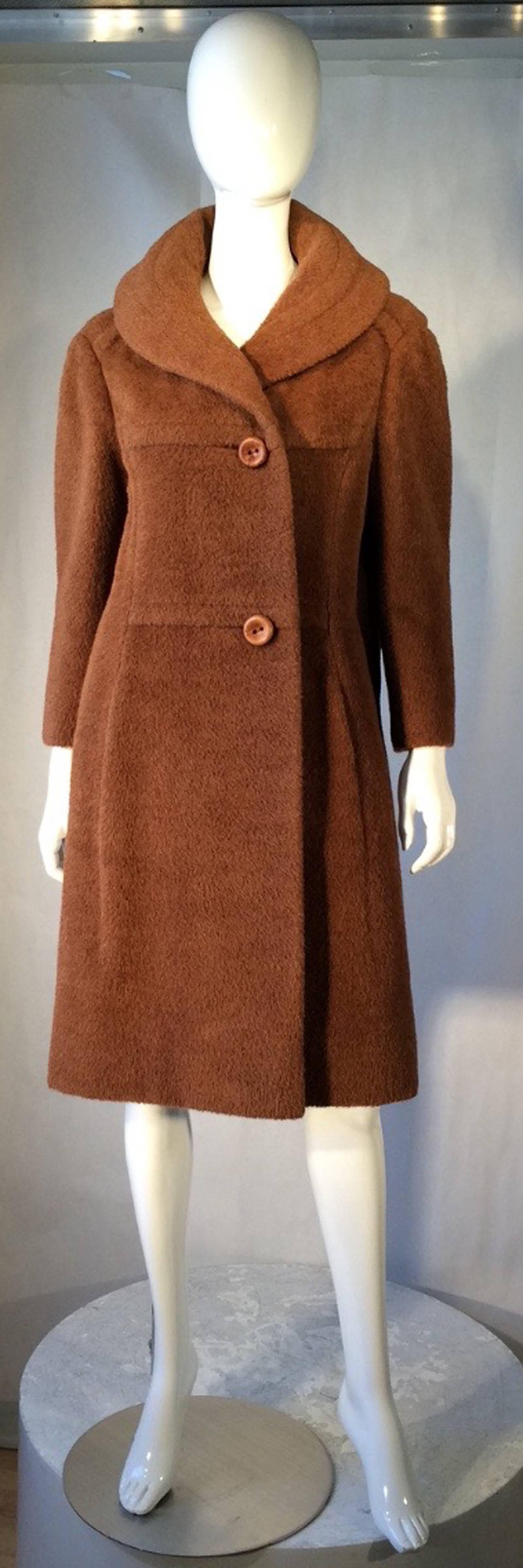 A fine and rare vintage Galanos mohair coat. Sculpted wool item features a shawl collar, precision seams and unusual sculpted back panel. Item fully silk lined with original button front. Pristine possibly unworn.