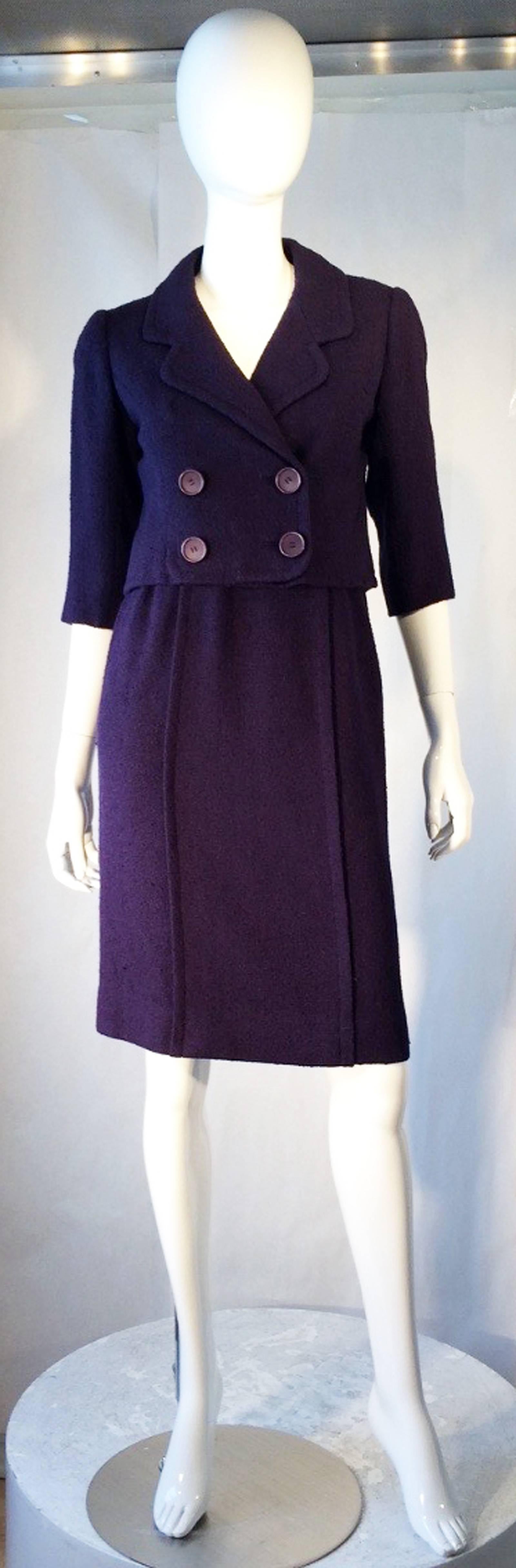 A fine and rare vintage Balenciaga haute couture skirt suit. Authentic numbered item circa 1957. Unusual dark lilac 2pc. wool frise fabric items feature precision seams with original buttons, zippers, hooks etc. Excellent and rare item with no