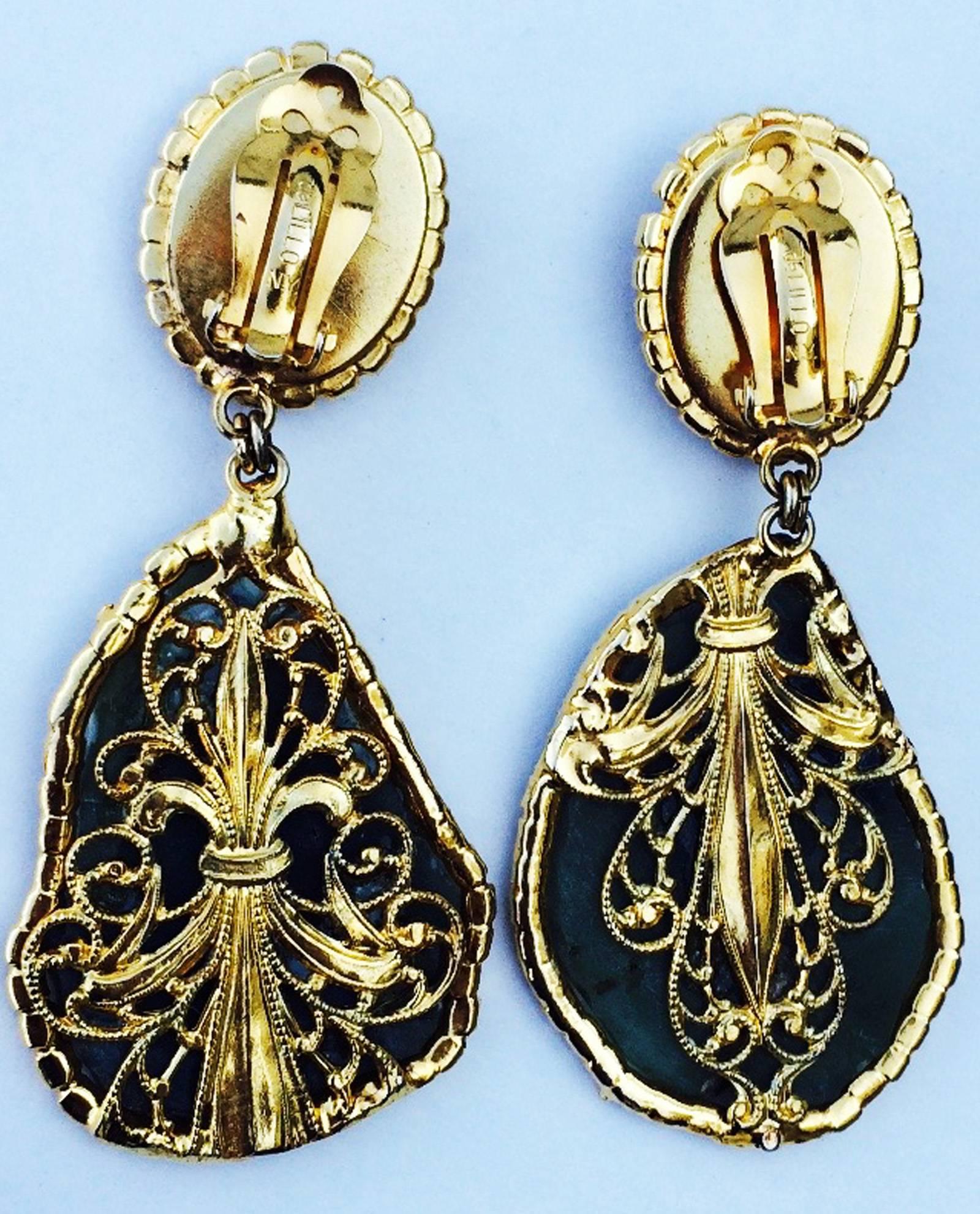 A fine and rare vintage Robert F. Clark for William de Lillo jade stone ear drops. Authentic signed hand-constructed one-off gilt metal items feature polished jade stones with prong set Swarovski crystal surrounds. Items retain original gilt metal