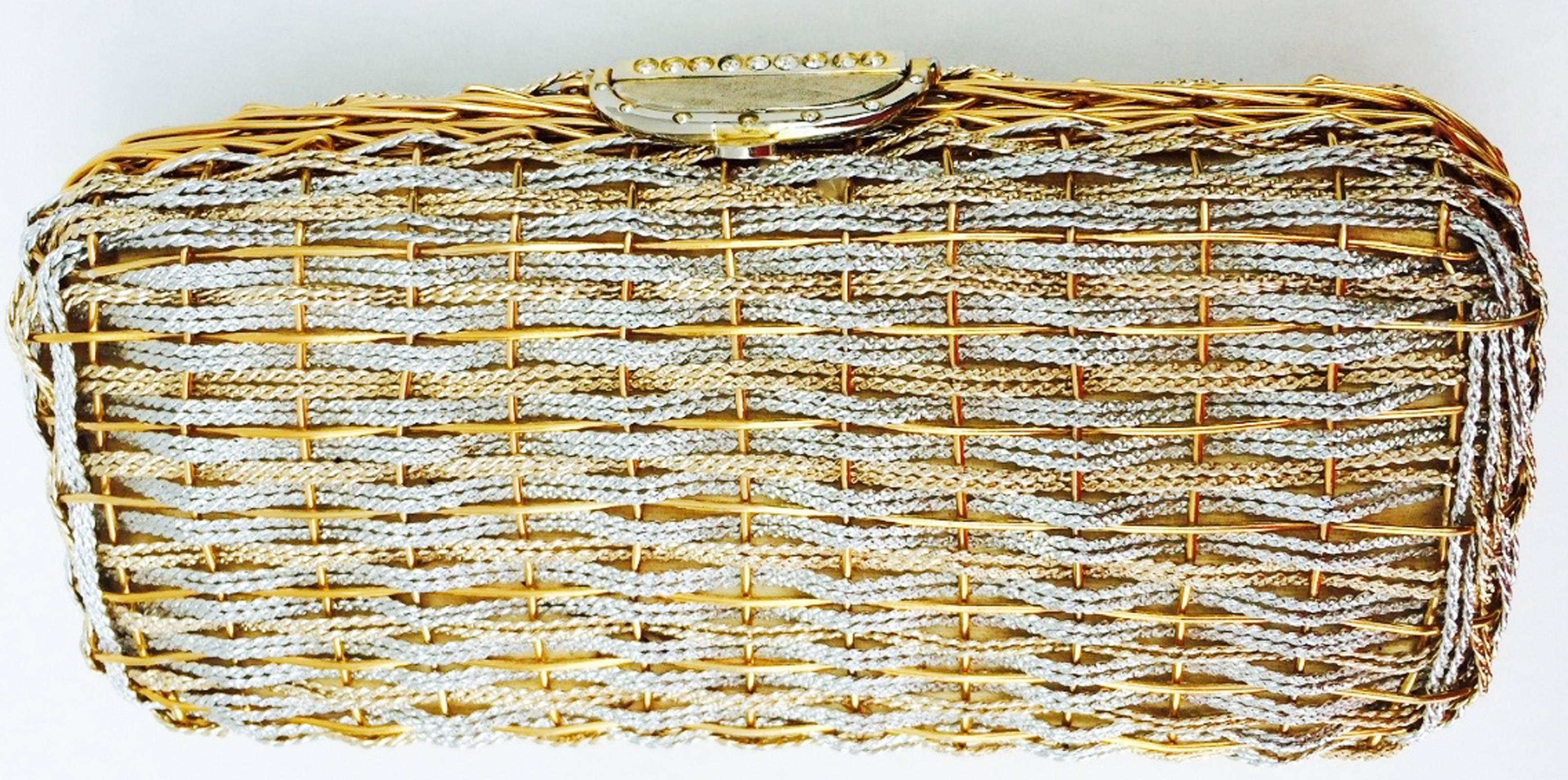 A fine vintage Koret minaudiere clutch handbag. Authentic woven two-tone (silver/gold) metal item features a gilt fold-over clasp. Bright metallic gold vinyl lining and crystal trim intact. Excellent.