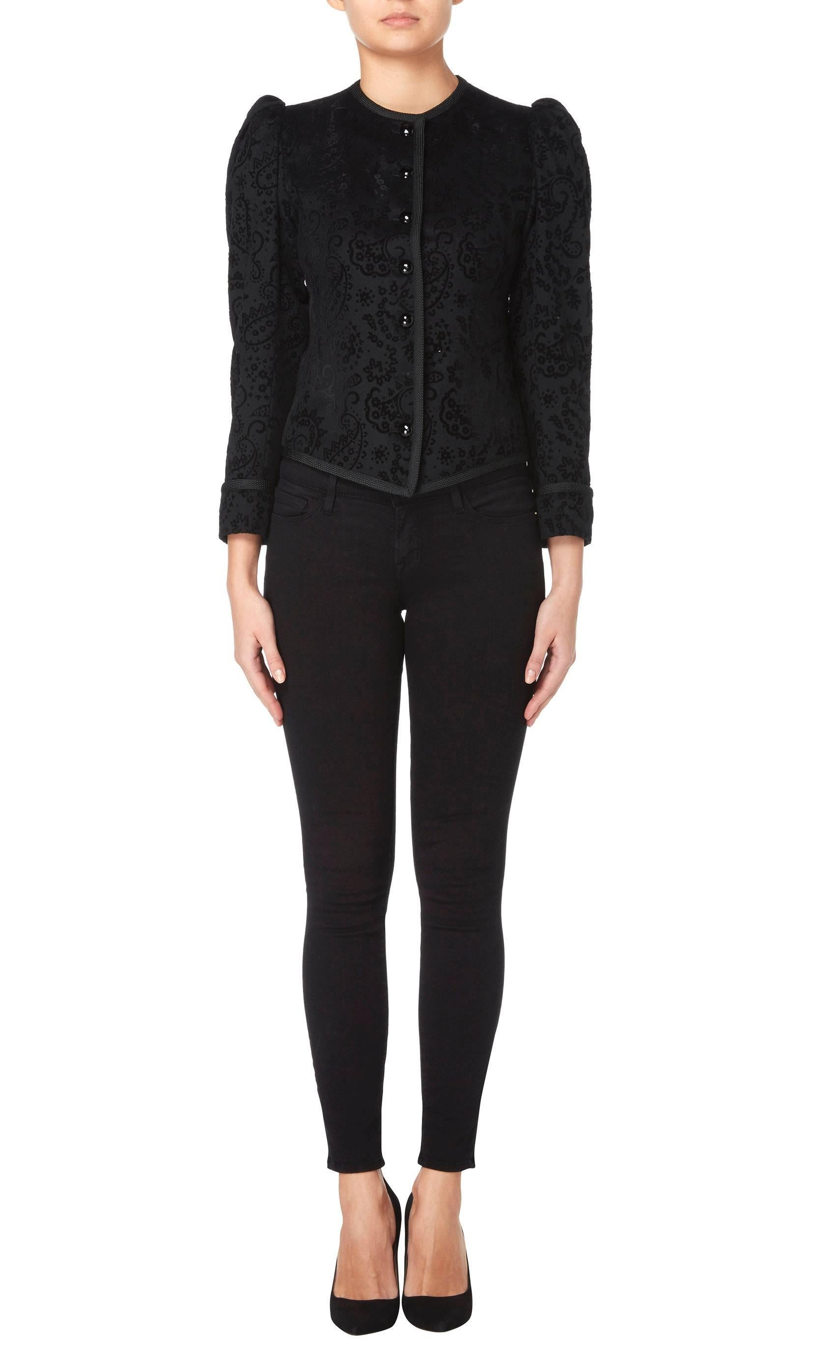 This Yves Saint Laurent jacket is a great way of introducing vintage into a contemporary wardrobe. Perfect for wearing with jeans and flats or with a cocktail dress for evenings, it is super versatile. Constructed in black wool with a flocked