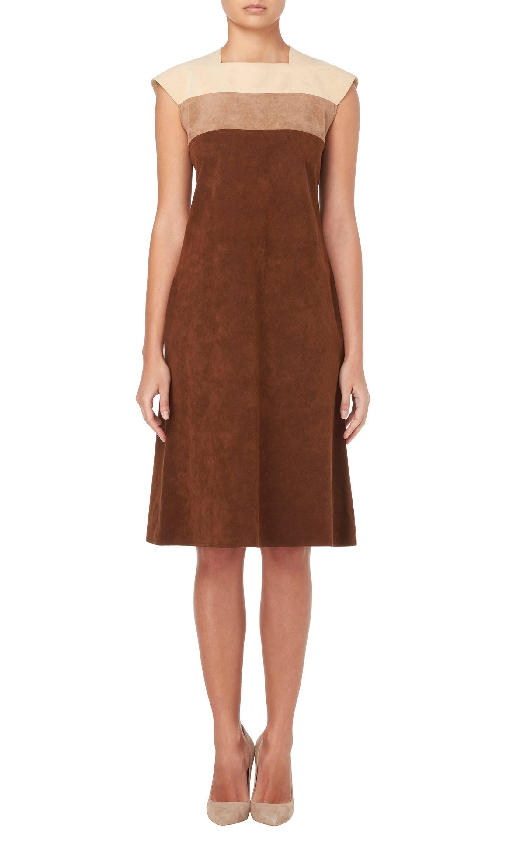 A great day dress, this Mollie Parnis shift is so easy to wear. Constructed in soft brown ultrasuede, the dress features a square neckline and panels of tan and ivory, creating a neutral colour blocked effect.

Constructed in shades of brown