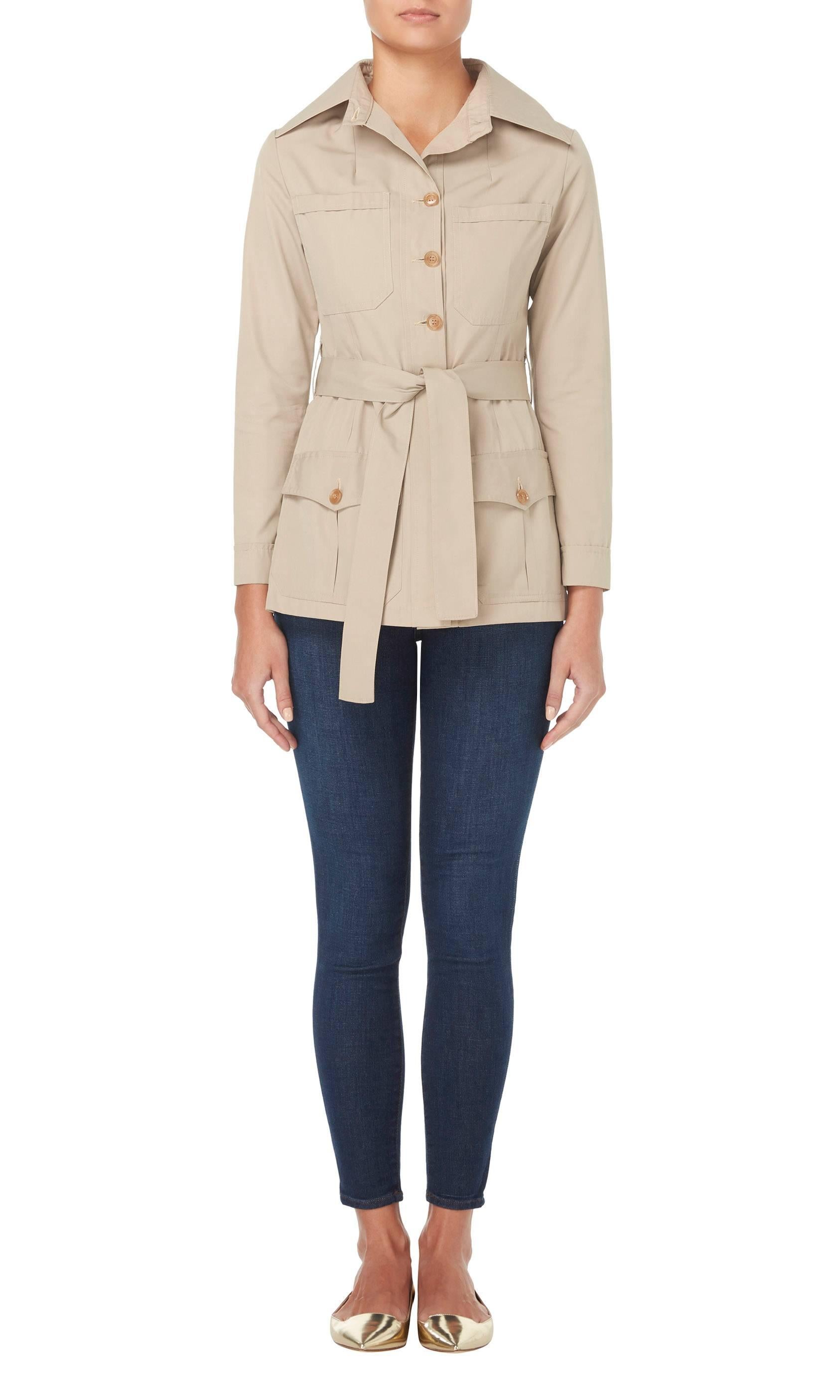 A great piece for everyday, this Ossie Clark safari style jacket will look great worn with skinny jeans and sandals. Constructed in sand-coloured cotton, the jacket features an exaggerated collar and buttons fastening to the front. With a flattering