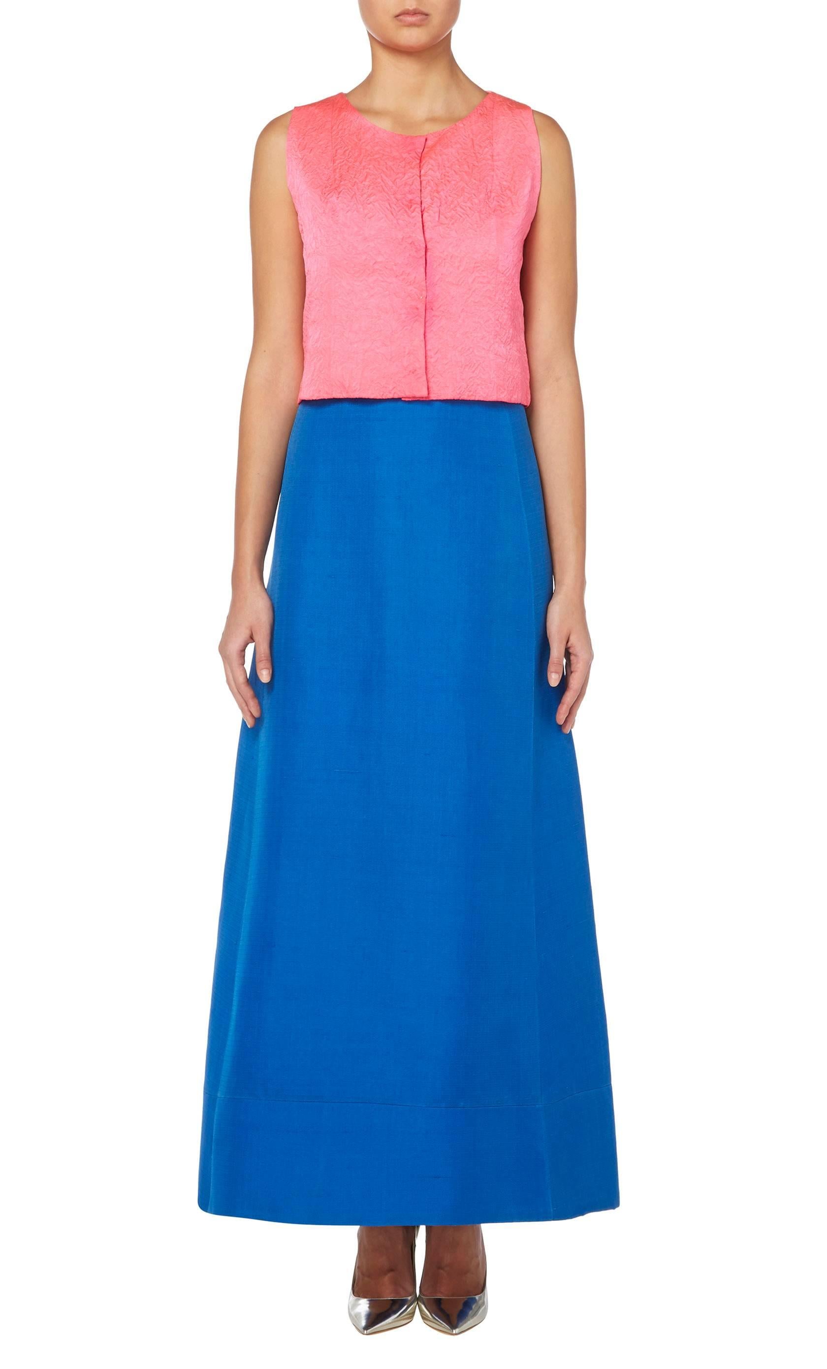 This colourful ensemble by Balenciaga for his early Eisa label is amazingly versatile. With a sleeveless top in shocking pink cloqu̩ silk and a bright blue silk gazaar maxi skirt, the piece also has the original pair of matching shoes. Wear together