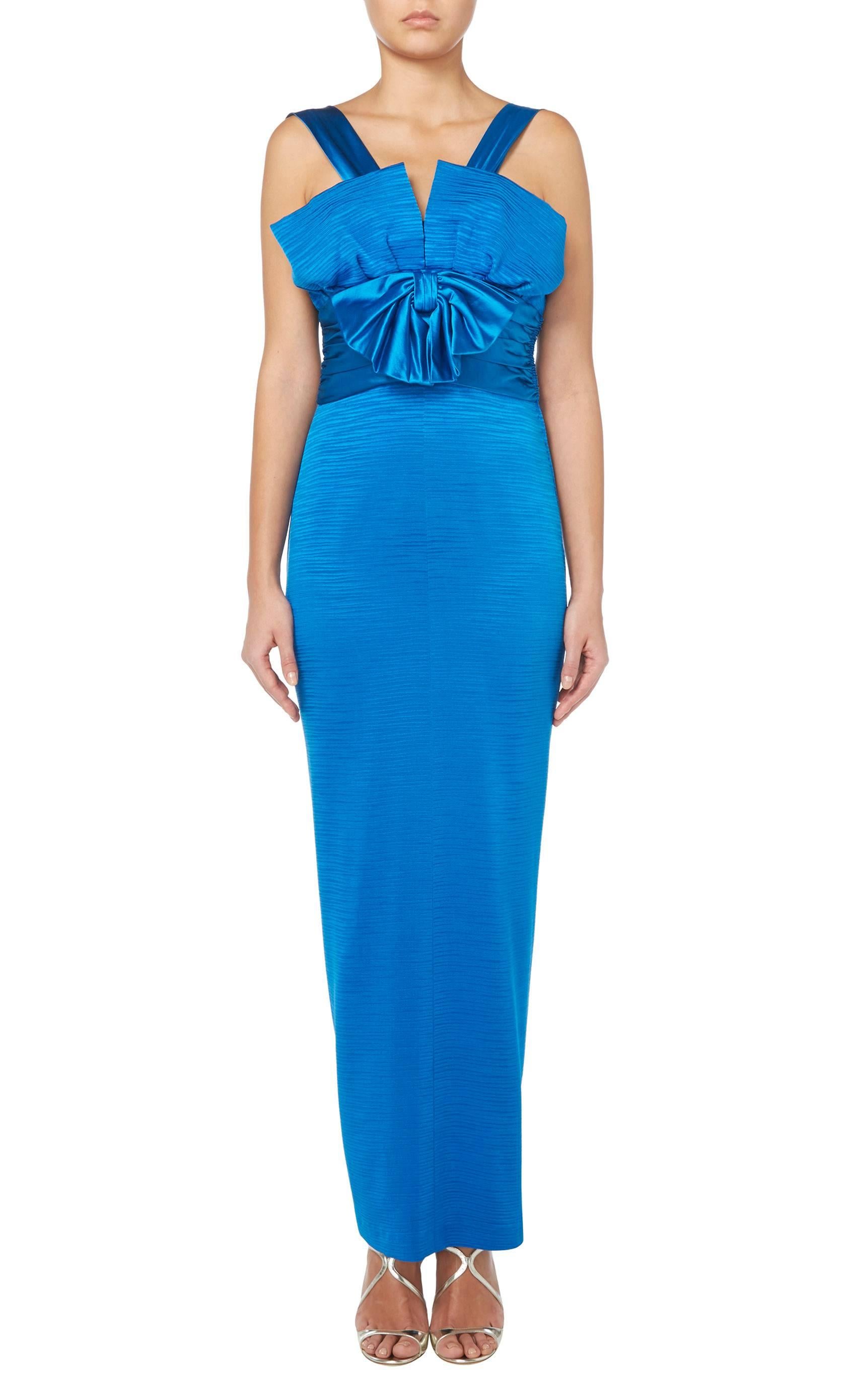 The epitome of Hollywood glamour, this gown is simply perfect for red carpet or black tie events. Constructed in a stunning shade of blue ribbed silk, the gown creates a flattering hourglass silhouette, skimming the body seductively and falling into