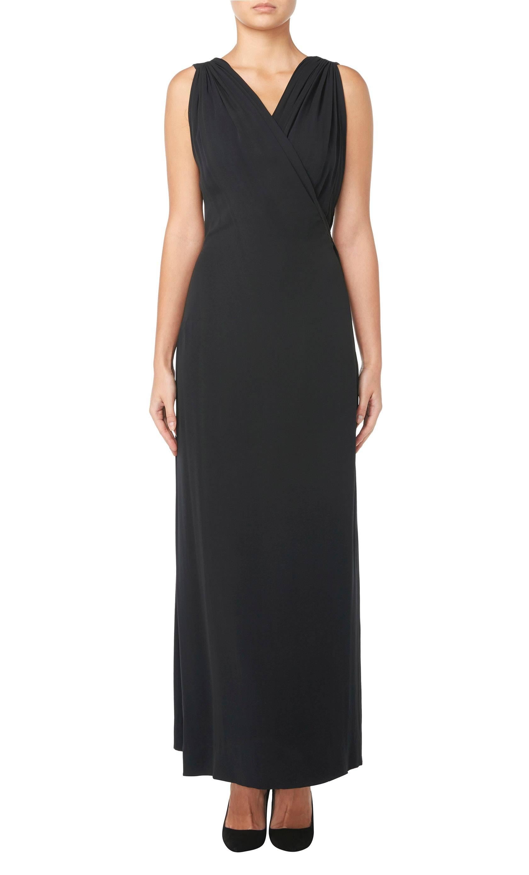 
A fabulously chic dress by Paquin, the legendary French haute couture house, this is a wonderfully wearable dress ideal for a Black Tie event. Crafted in black silk crepe, the dress is a beautifully-cut, well-shaped piece of haute couture sold