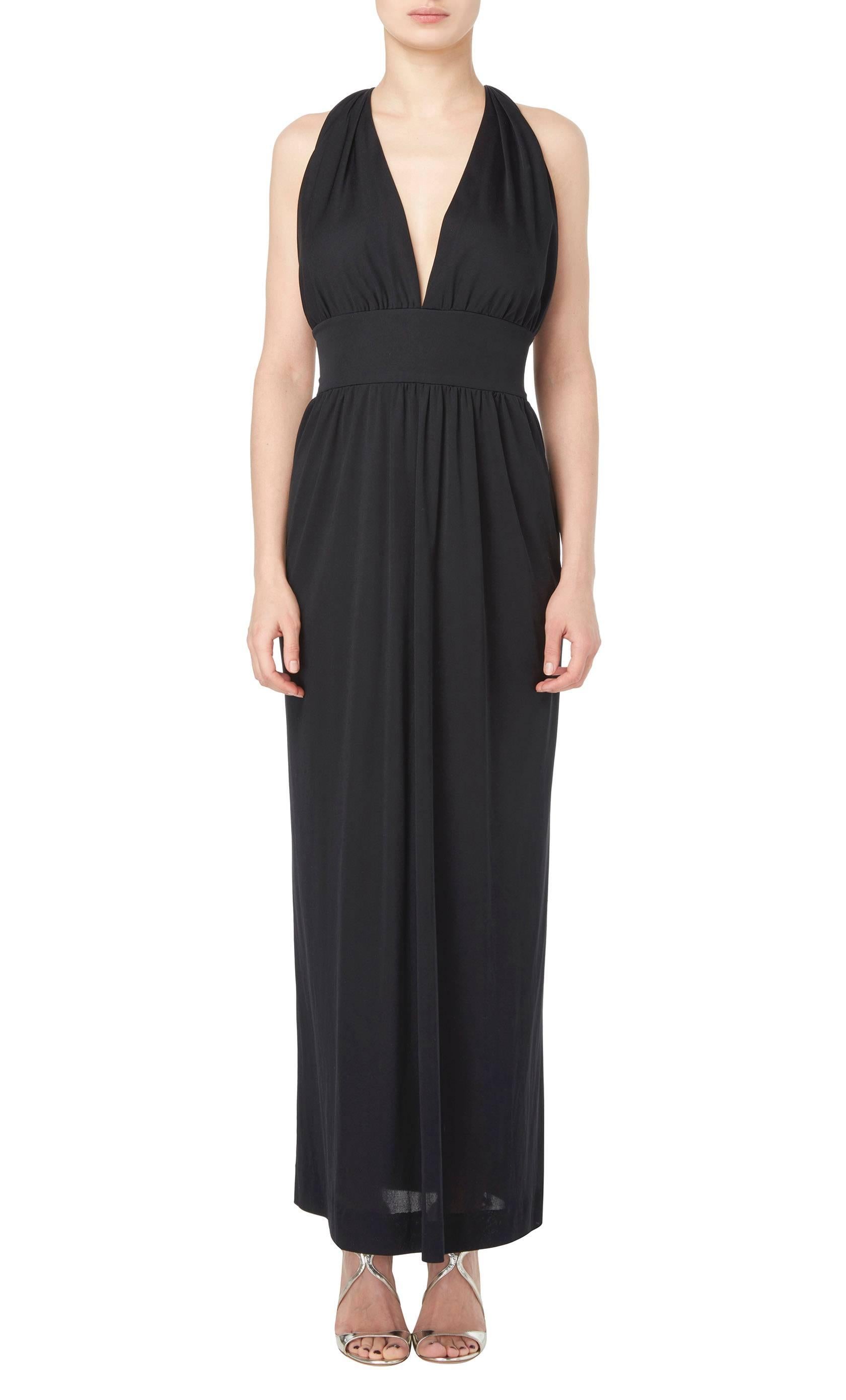 
This stunning Pucci maxi dress is the ideal summer dress, constructed in airy black silk artfully gathered over the bust, the dress has a flattering halterneck style back and a wide waistband adding definition to the silhouette. Throw on for hot