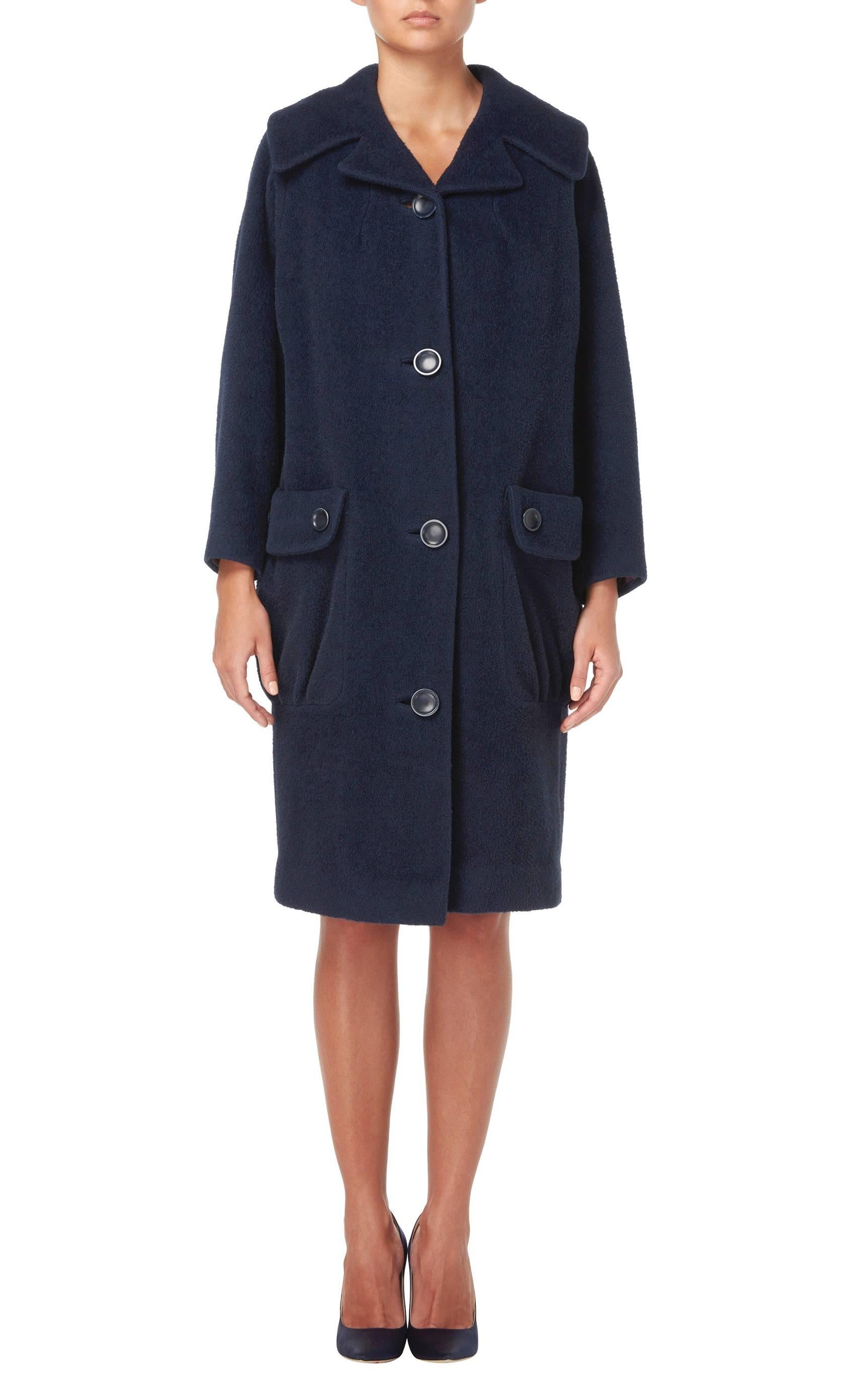 This Pierre Cardin coat is constructed in an amazing shade of petrol blue wool. Smart enough for the office, this coat will look just as good worn with jeans for weekends. Featuring an exaggerated double lapel collar and overscale outside pockets on