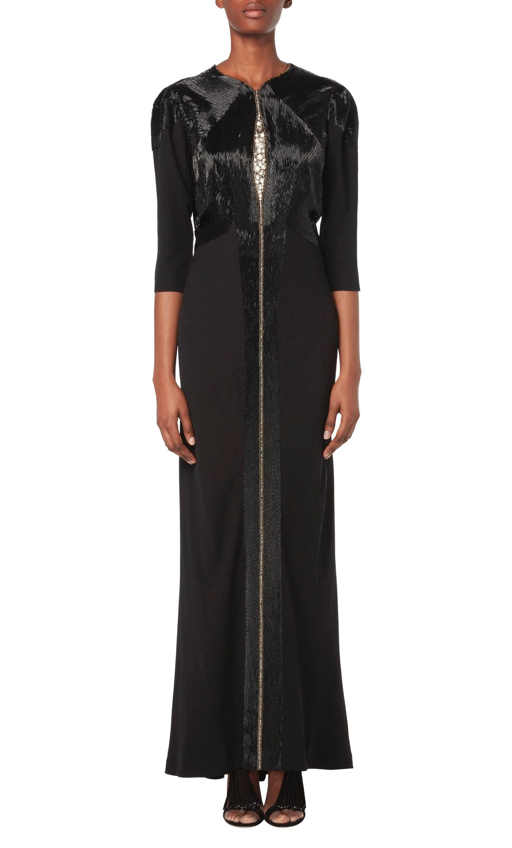 This rare example of Lucien Lelong channels Art Deco glamour perfectly. Lelong was not only a leading couturier of the 1930s but also the head of the Haute Couture Syndicate and the man who discovered Balmain and Dior. Constructed in black silk