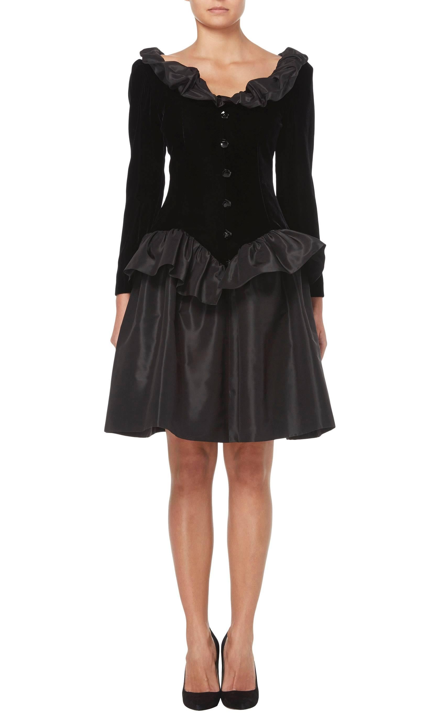 This fabulous Givenchy haute couture LBD will inject a touch of fun into a contemporary wardrobe. Perfect for parties, the dress is constructed in soft black velvet and with a taffeta skirt and ruffle trims to the neck and waist. With a flattering