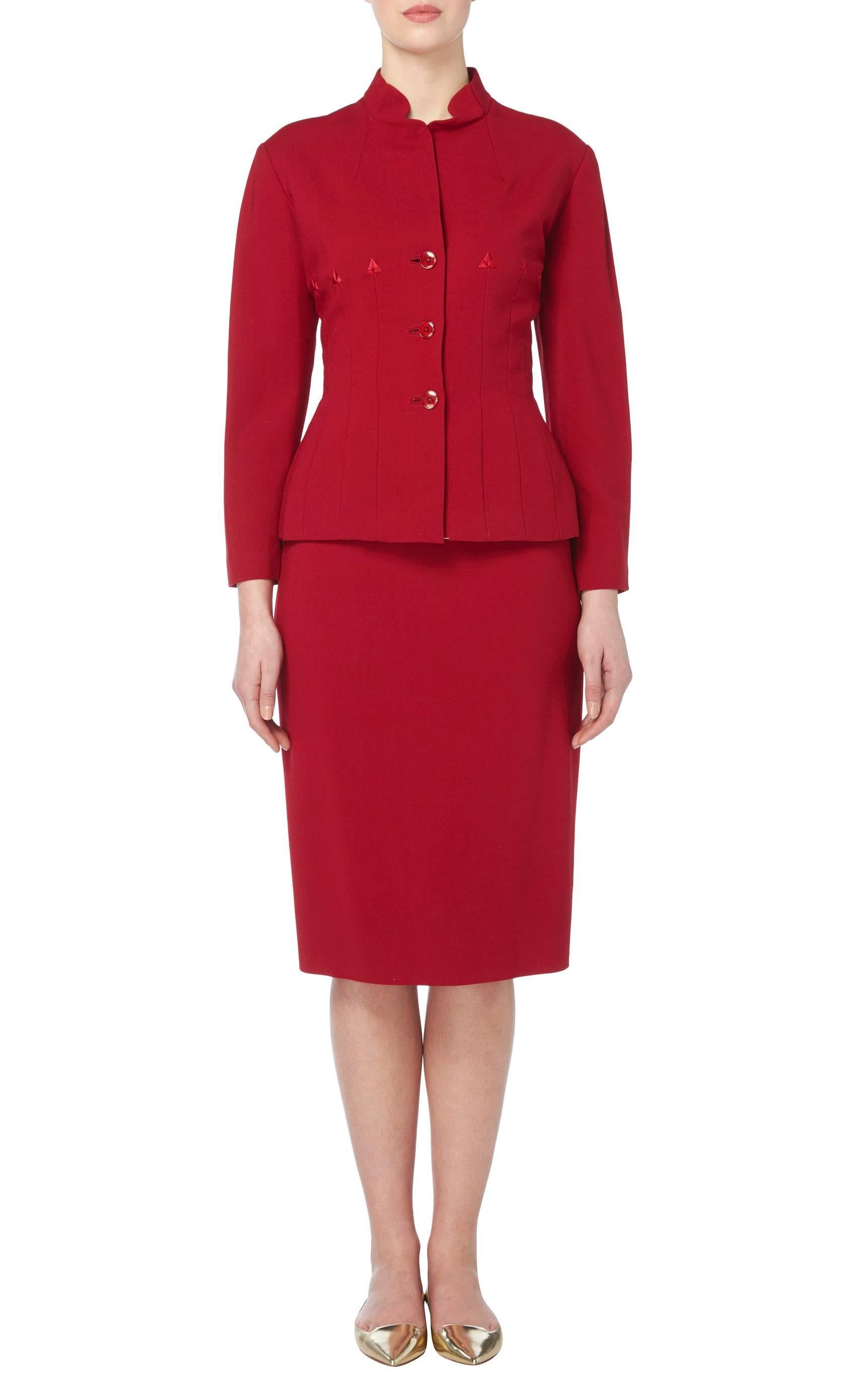 An amazing example of Jacques Fath love of the hourglass silhouette, this beautifully tailored skirt suit will look fabulous in or outside of the boardroom. The shoulder pads, nipped in waist and padded hips of the jacket create a highly flattering