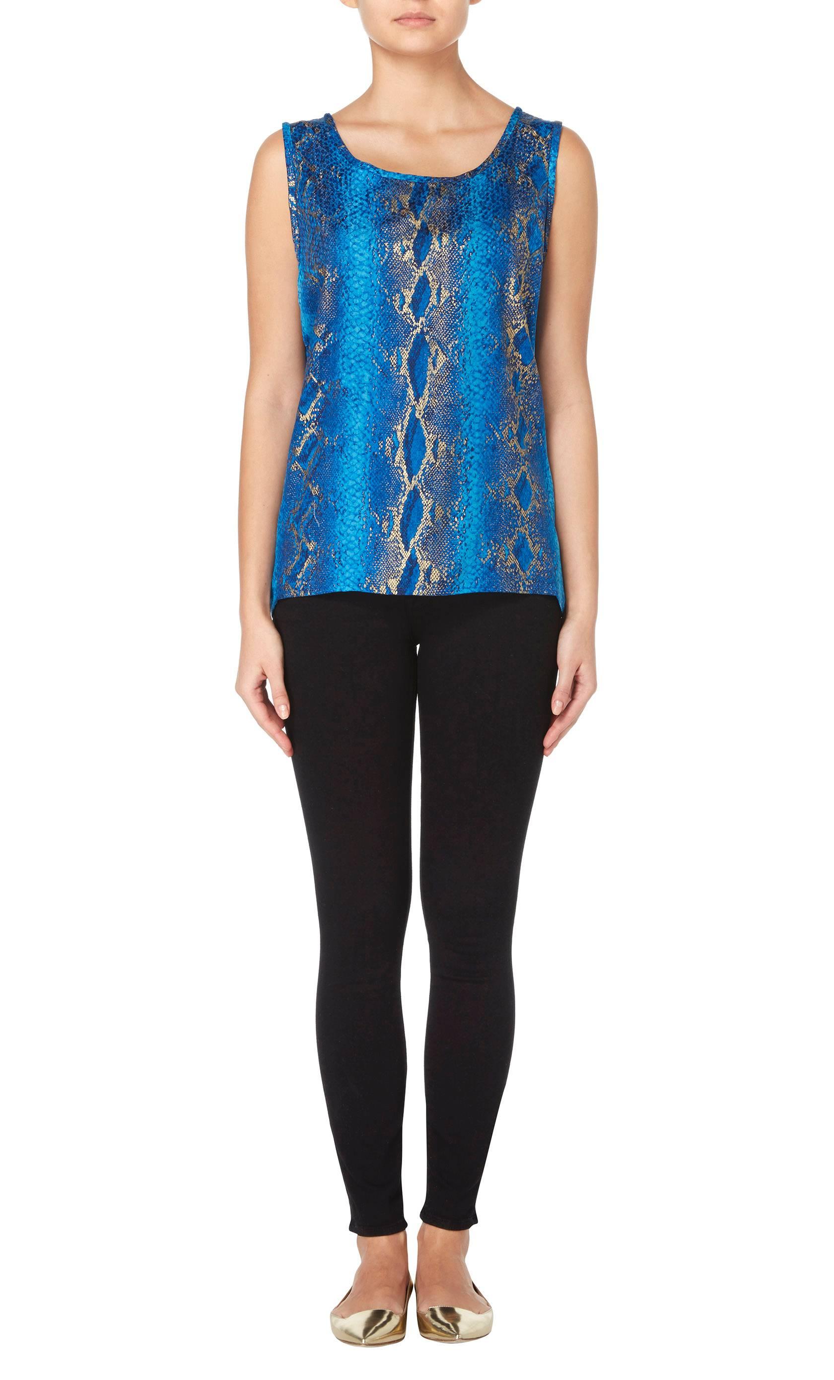 A colourful piece for everyday, this Yves Saint Laurent tank top will look amazing worn under a jacket and teamed with skinny jeans. Constructed in blue snakeskin print silk, the top has metallic gold detailing making it perfect for day or